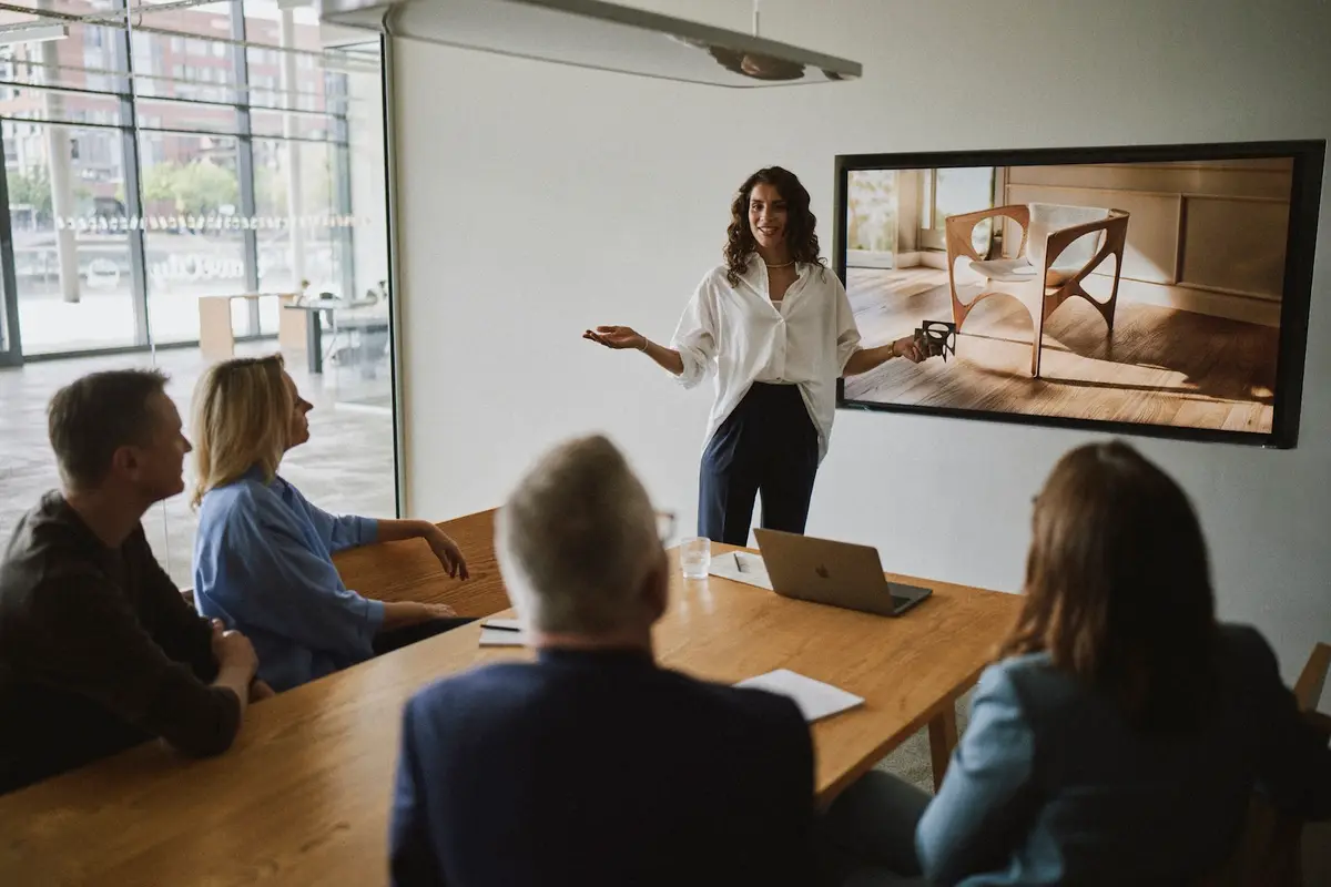 Woman presenting in front of a screen