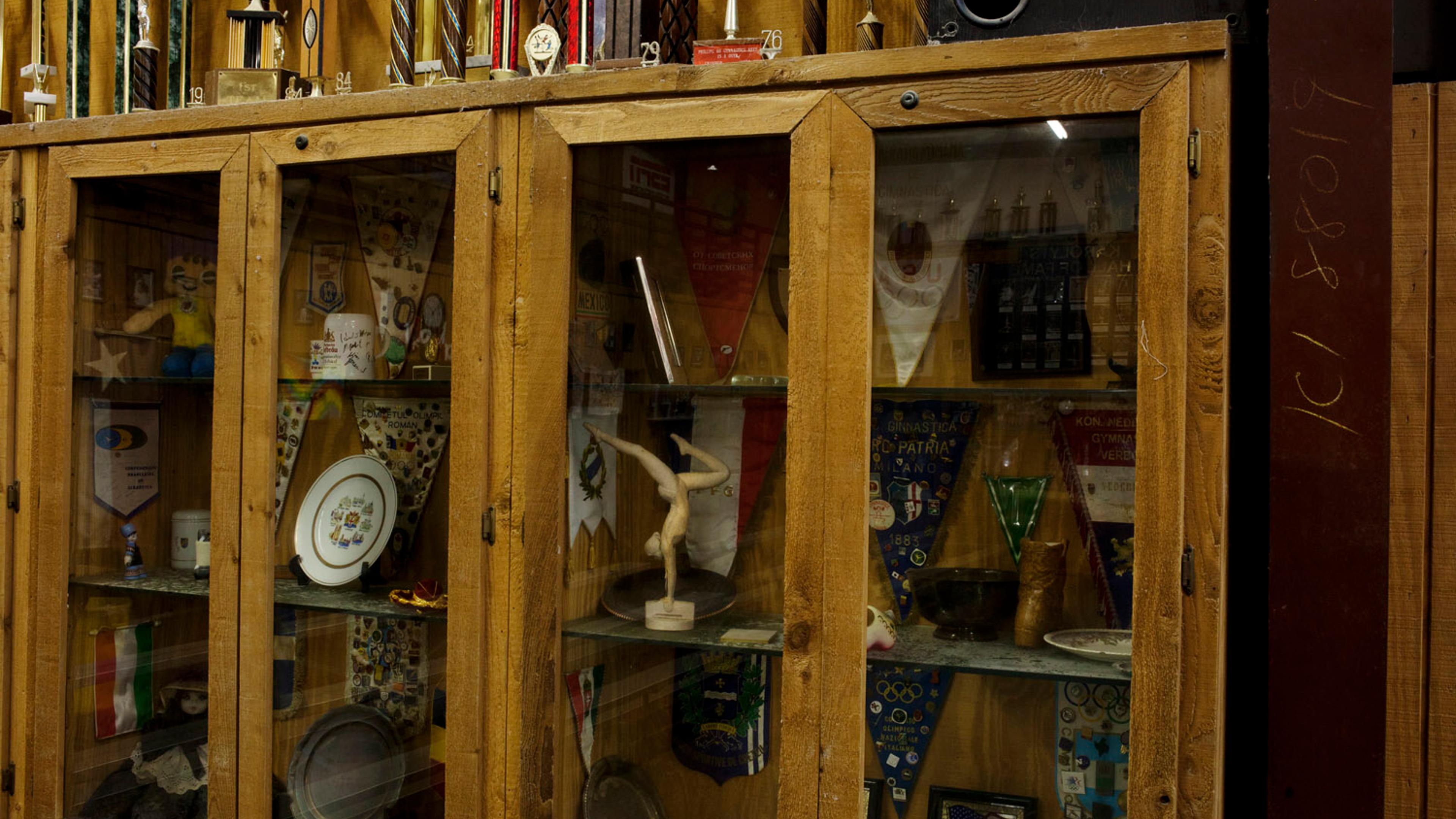 A display of gymnastics trophies and awards at Karolyi's Camp.