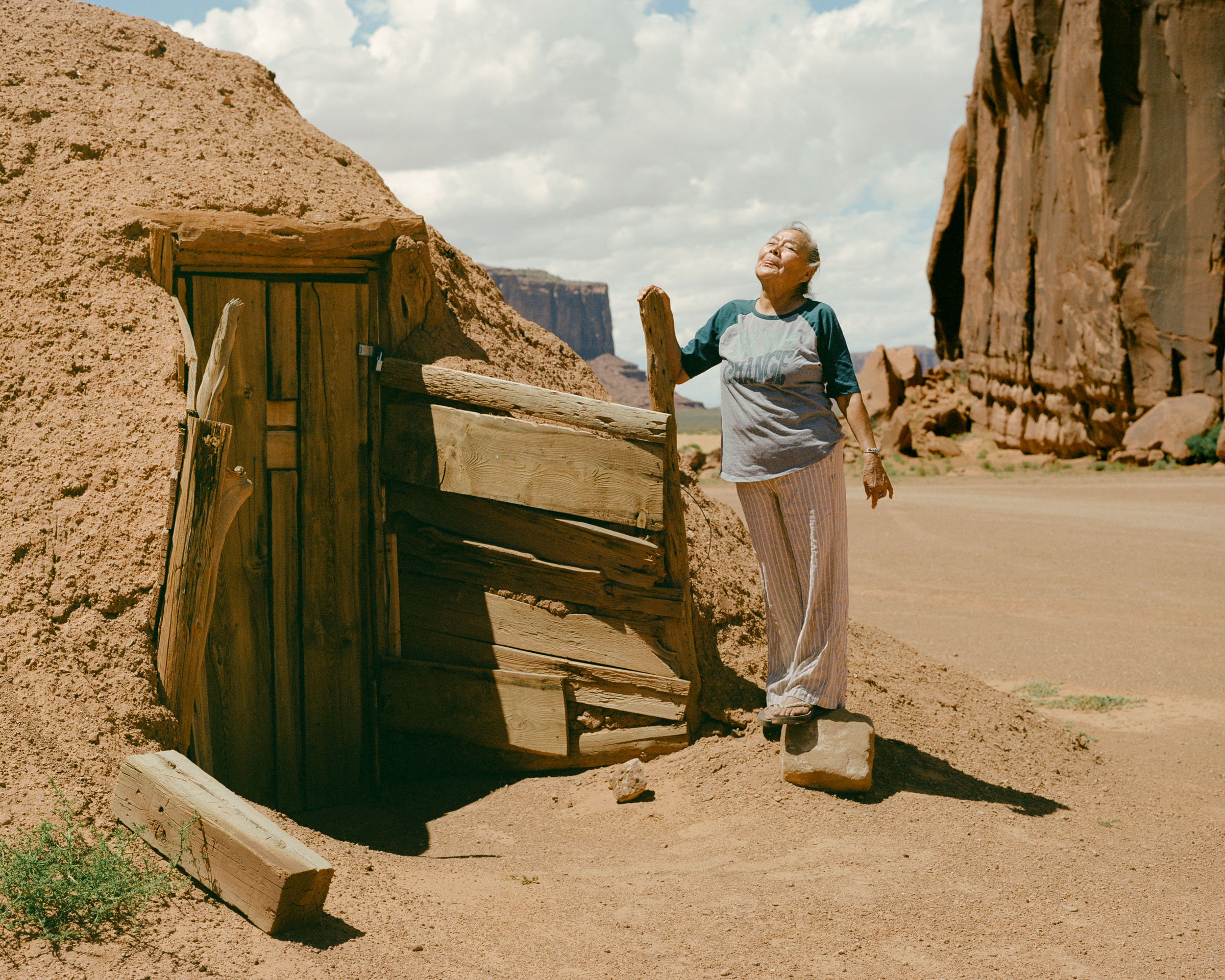  Effie Yazzie relishing a day at home outside the hogan her mother lived in.