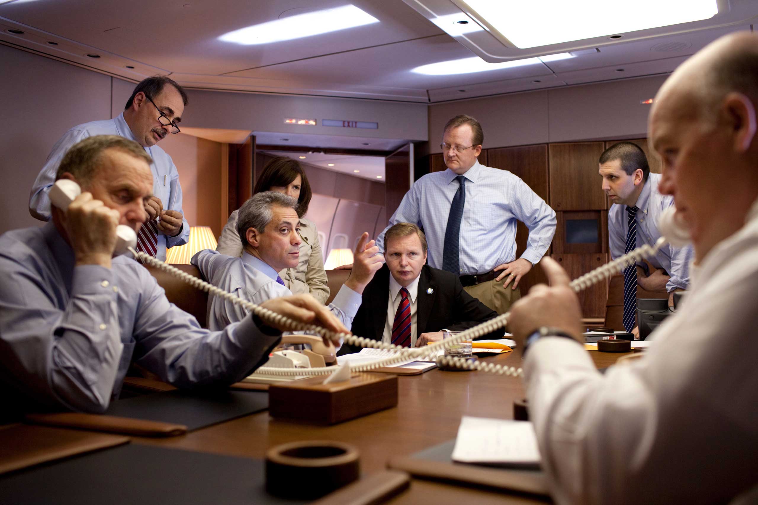 National Security Advisor General James Jones, left, and USSS Special Agent in Charge Joe Clancy coordinate arrival details by telephone for President Barack Obama's visit to Baghdad on April 7, 2009. Joined also by White House Senior Advisor David Axelr