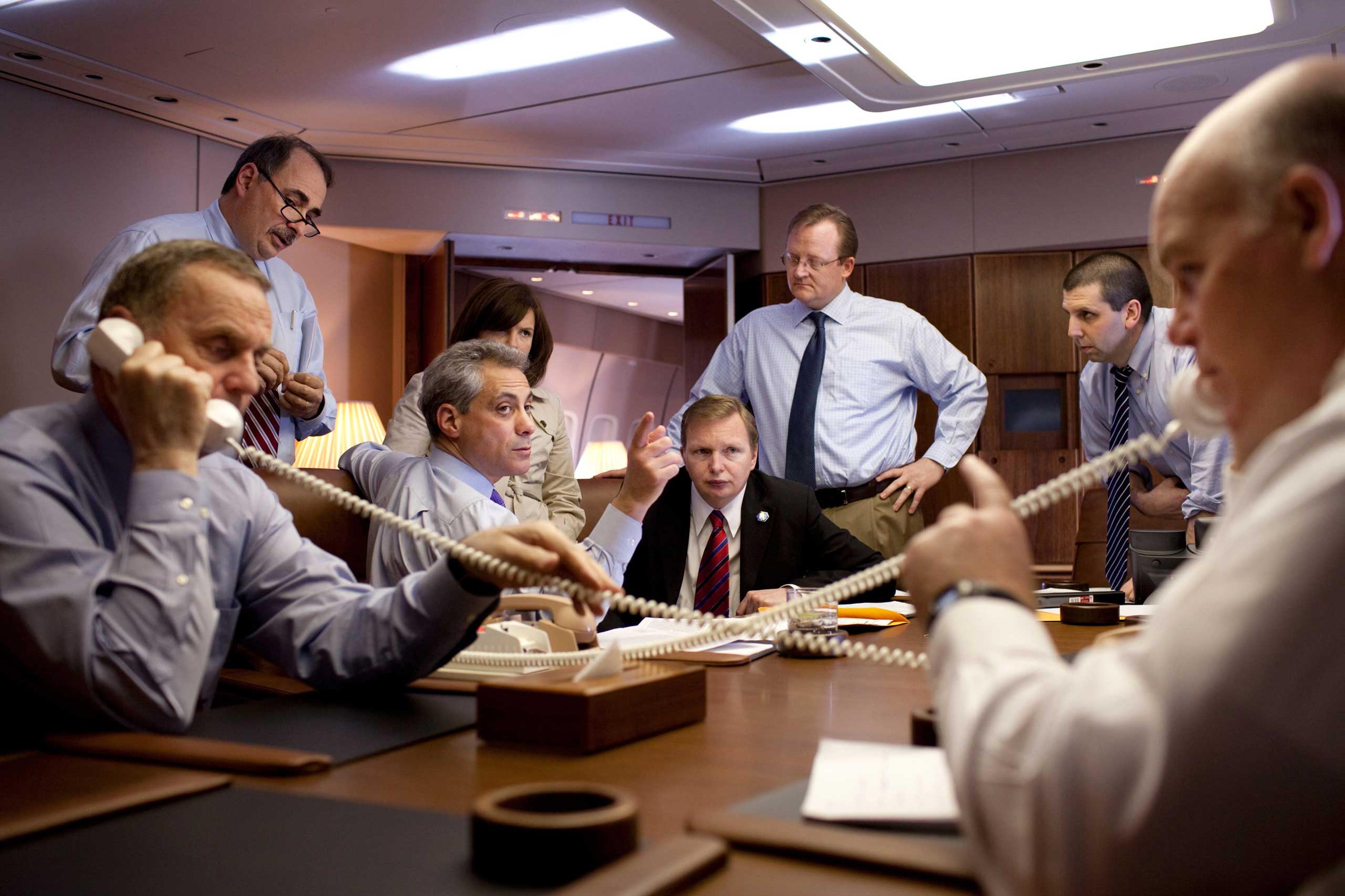 National Security Advisor General James Jones, left, and USSS Special Agent in Charge Joe Clancy coordinate arrival details by telephone for President Barack Obama's visit to Baghdad on April 7, 2009. Joined also by White House Senior Advisor David Axelr