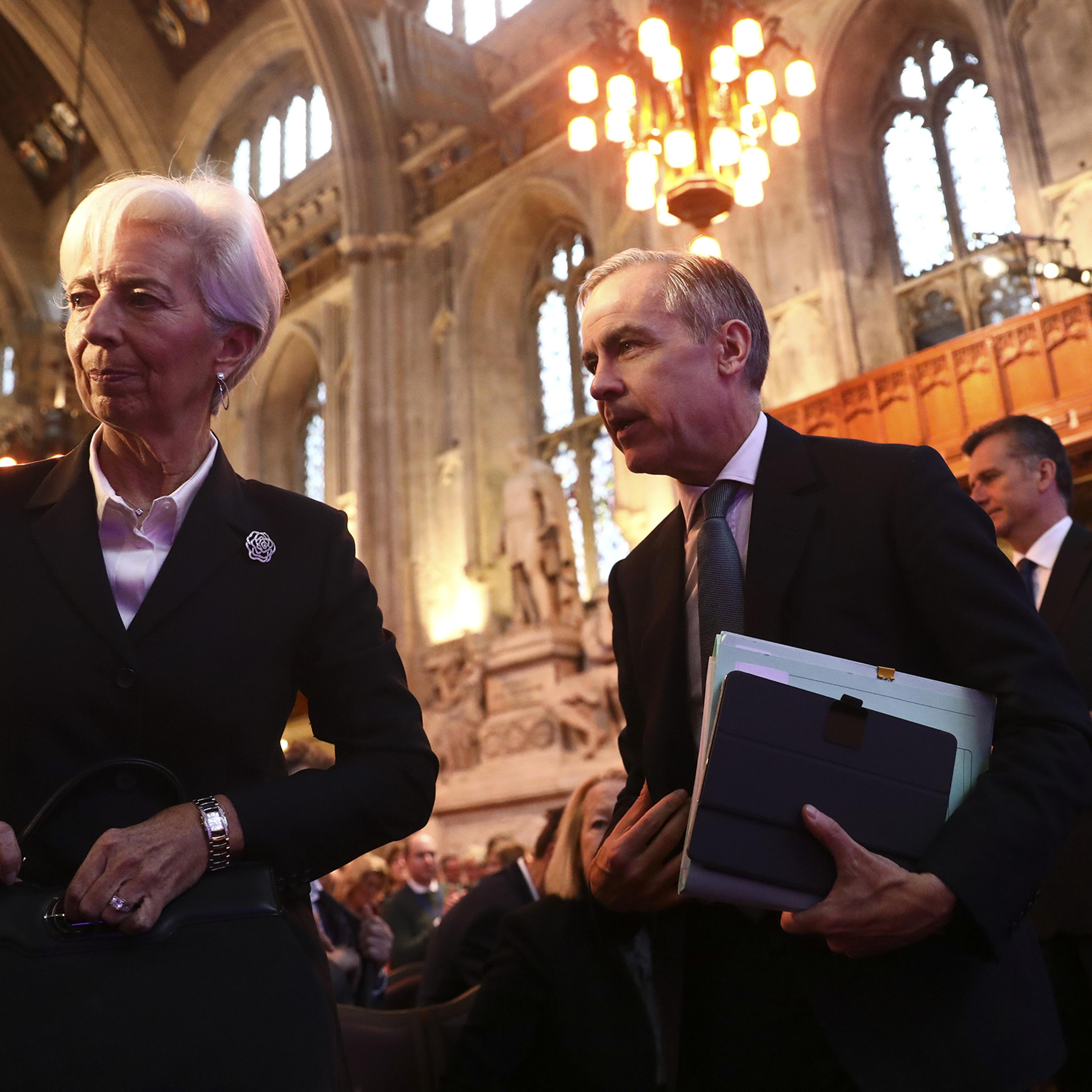 Christine Lagarde, president of the European Central Bank, left, and Mark Carney, former governor of the Bank of England, center, attend the launch of the COP26 Private Finance Agenda in London on Feb. 27, 2020