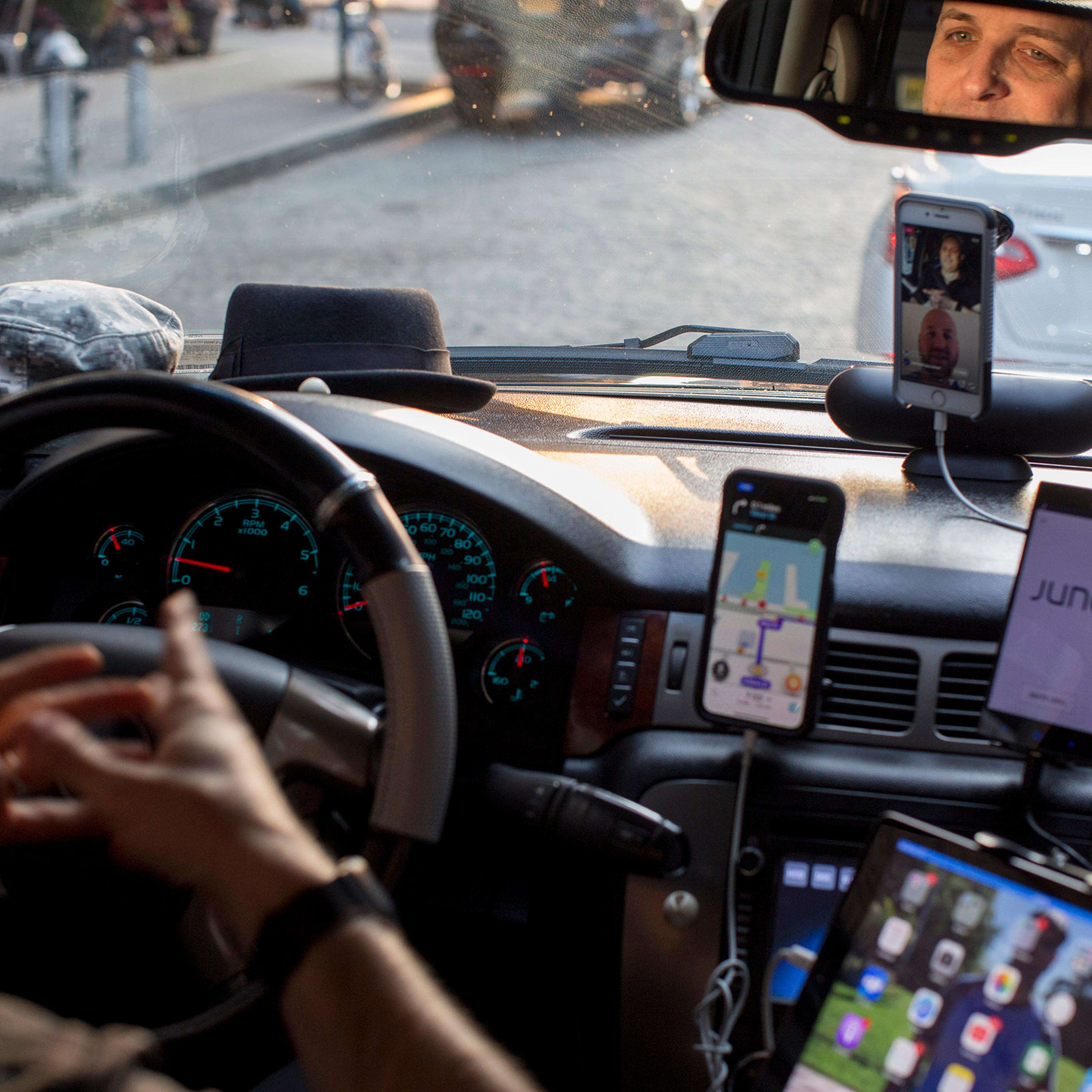 A driver for multiple ride-share companies with several devices on at once in New York, June 7, 2018. (Dave Sanders/The New York Times)
