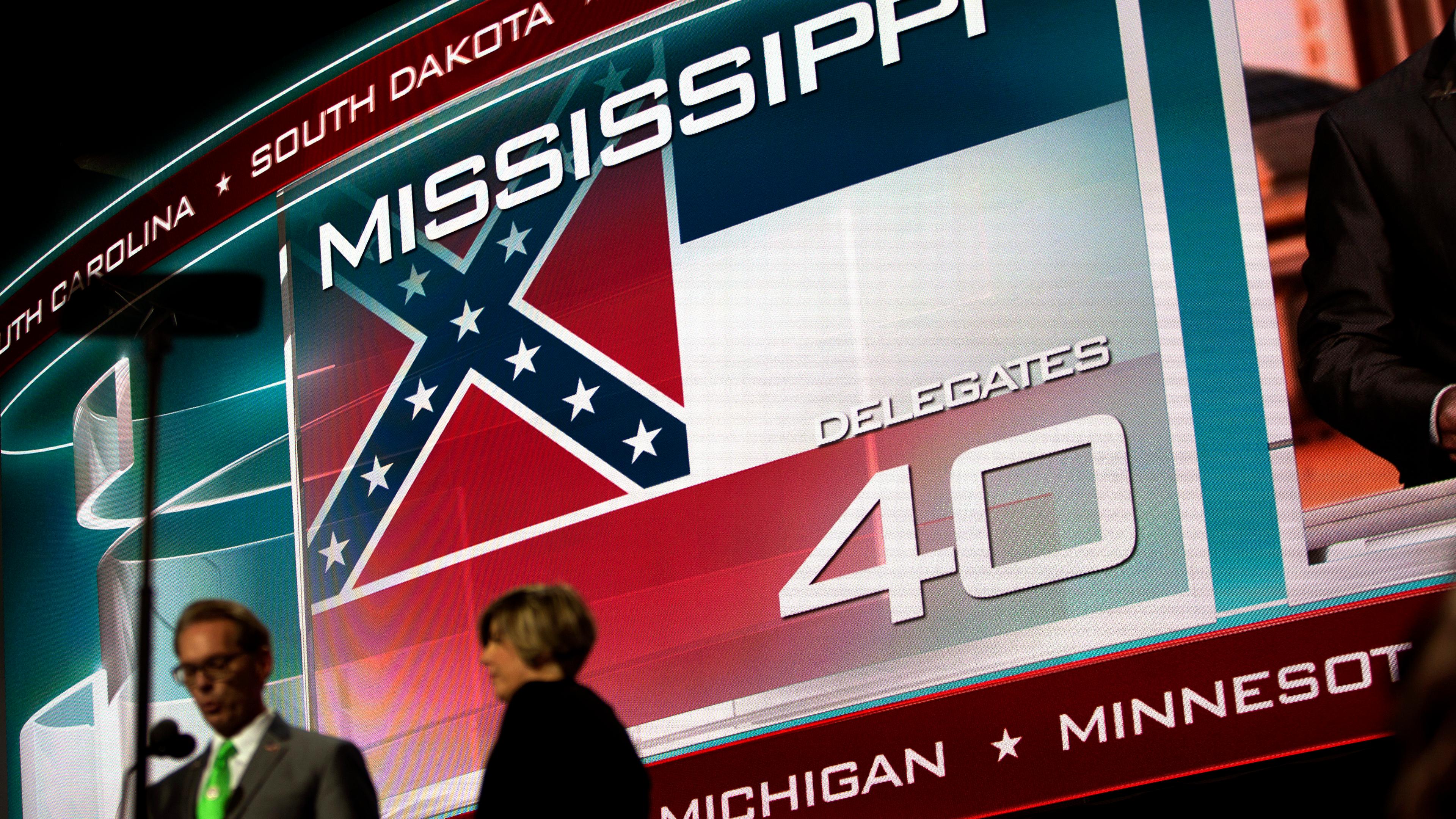 A screen displays the state flag of Mississippi, the only state that includes the Confederate battle emblem in its official state flag, at the Republican National Convention in Cleveland on Tuesday, July 19, 2016.
