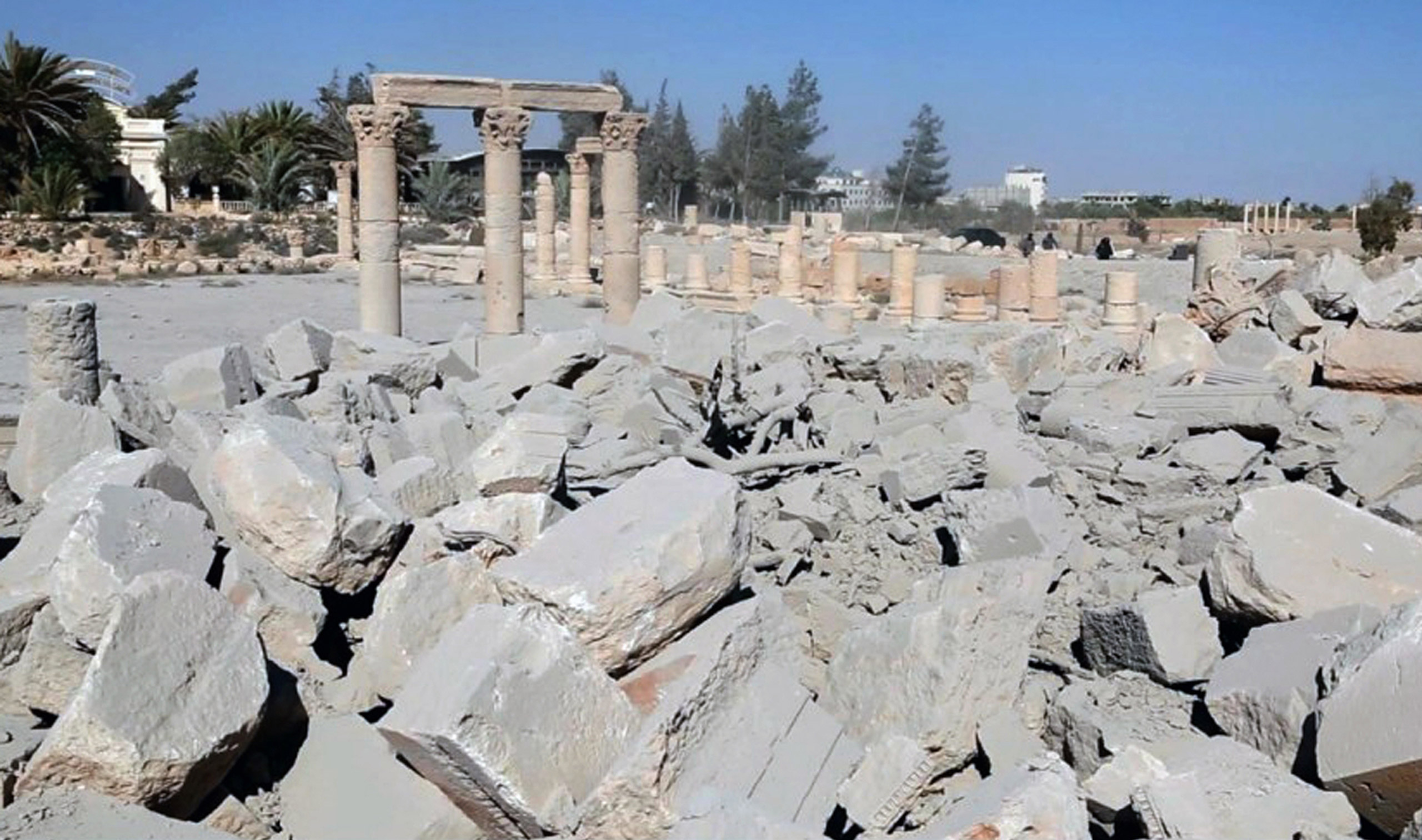 This undated photo released Tuesday, Aug. 25, 2015 on a social media site used by Islamic State militants, which has been verified and is consistent with other AP reporting, shows the demolished 2,000-year-old temple of Baalshamin in Syria's ancient cara