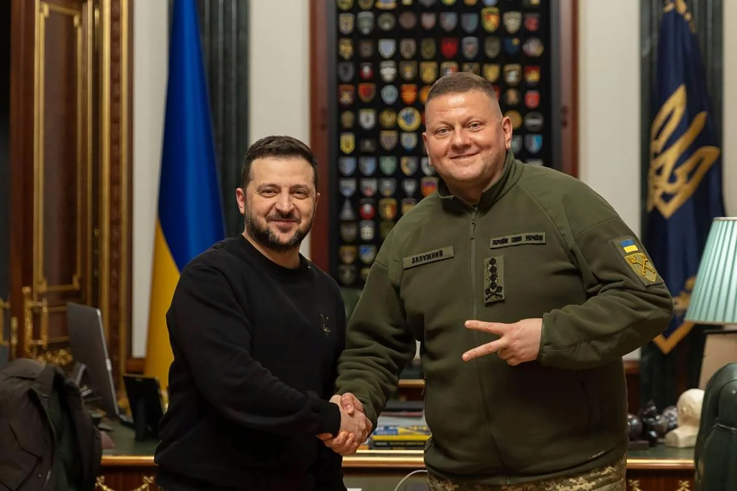 In this photo provided by the Ukrainian Presidential Press Office, Ukrainian President Zelensky, left, shakes hand with Commander-in-Chief of Ukraine's Armed Forces Valerii Zaluzhnyi during their meeting in Kyiv, Ukraine, Thursday, Feb. 8, 2024.
