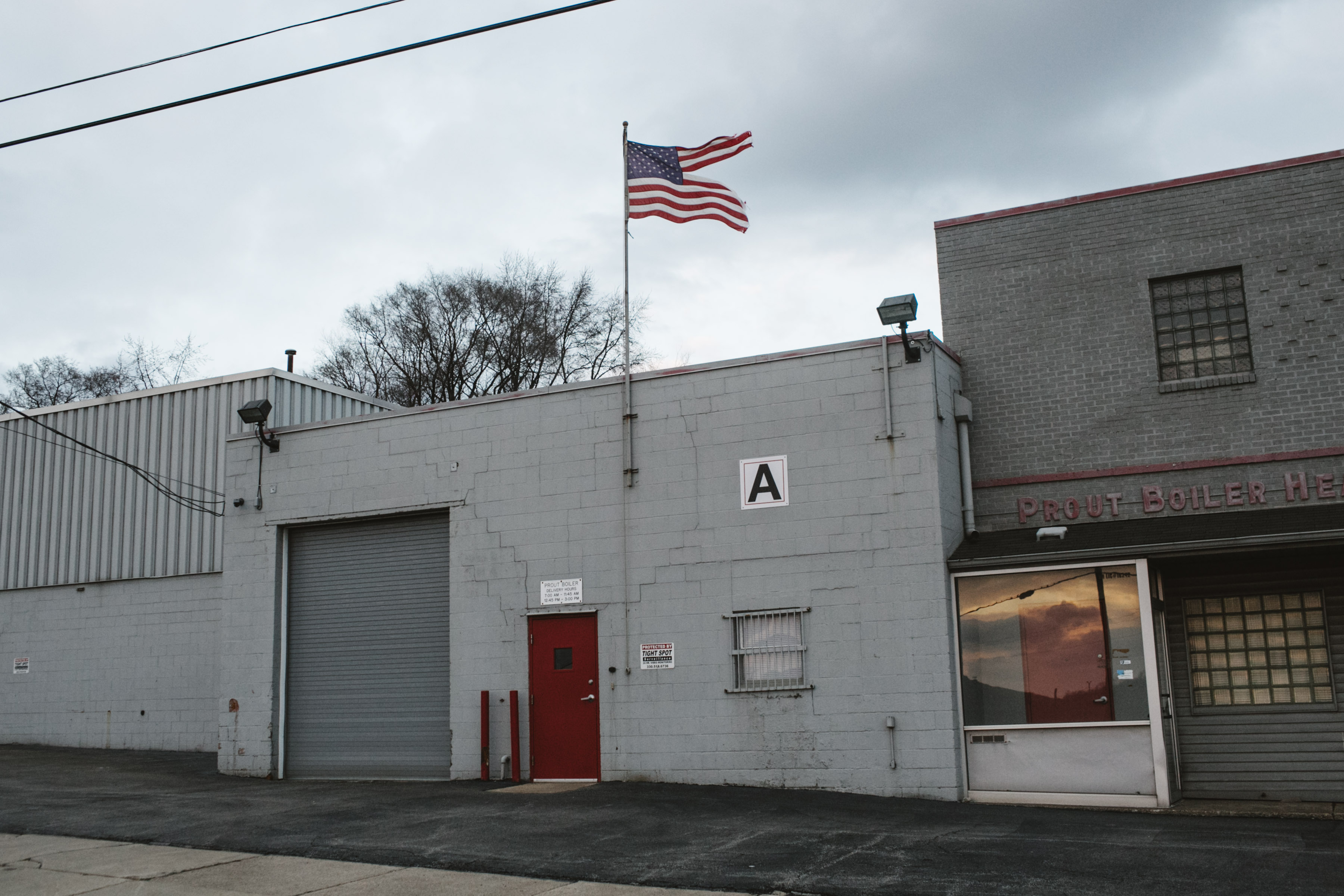 A tattered American flag flies over a heating business in Youngstown, Ohio on March 2, 2017. 
