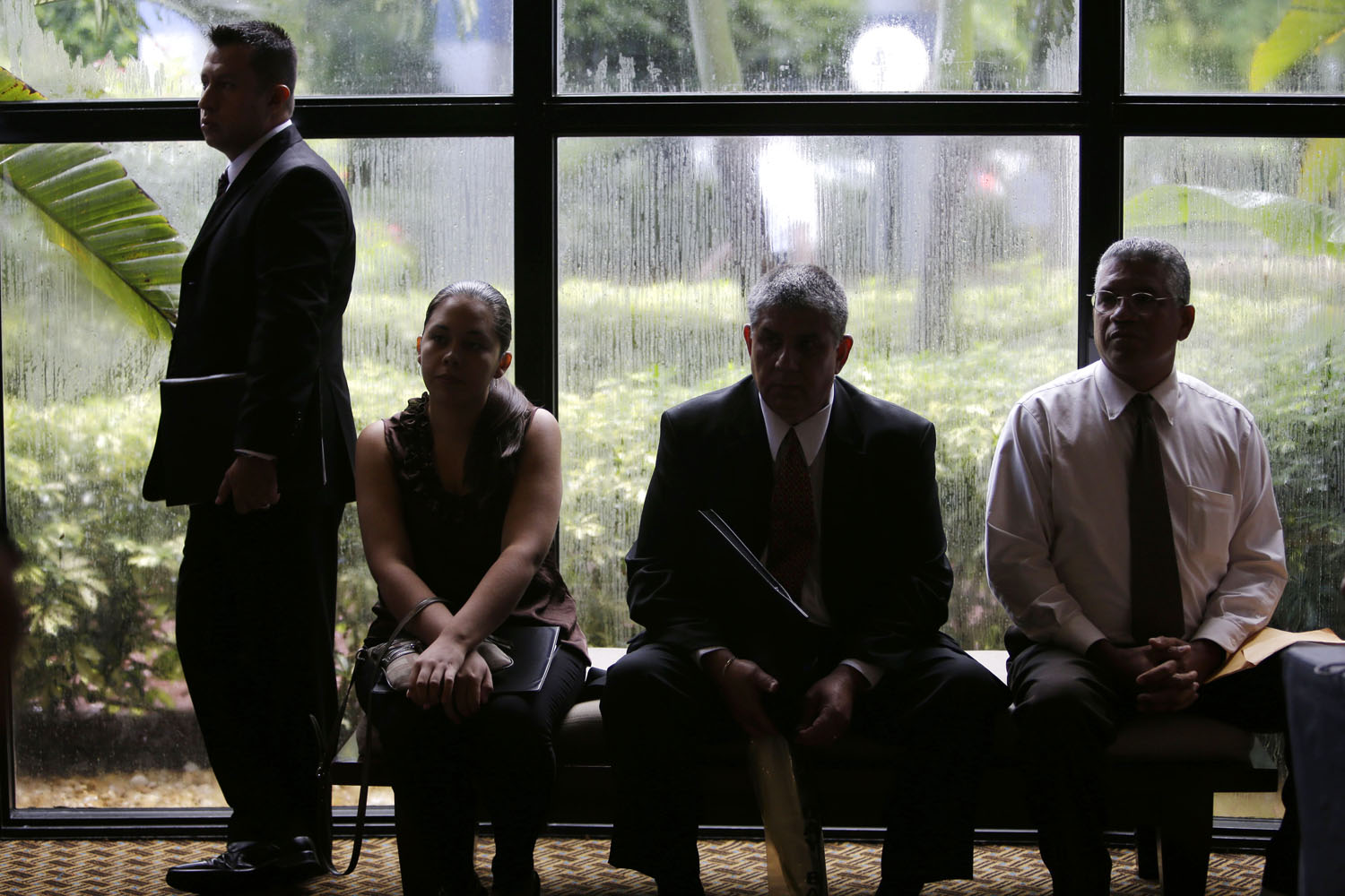 Job applicants wait for the opening of a job fair held by National Career Fairs in Fort Lauderdale, Fla., Sept. 17, 2012.