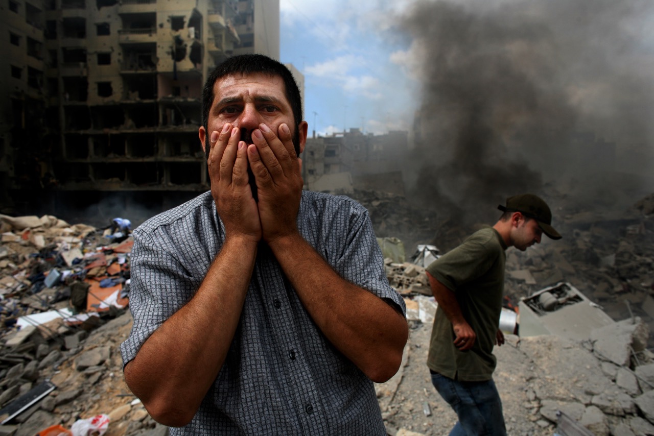 I took this picture 5-10 minutes after the bombing in a neighborhood in southern Beirut because I had been taking pictures there. I got to the sight immediately with the Red Cross and there was nothing to be found. It was August 13, at the very end of th