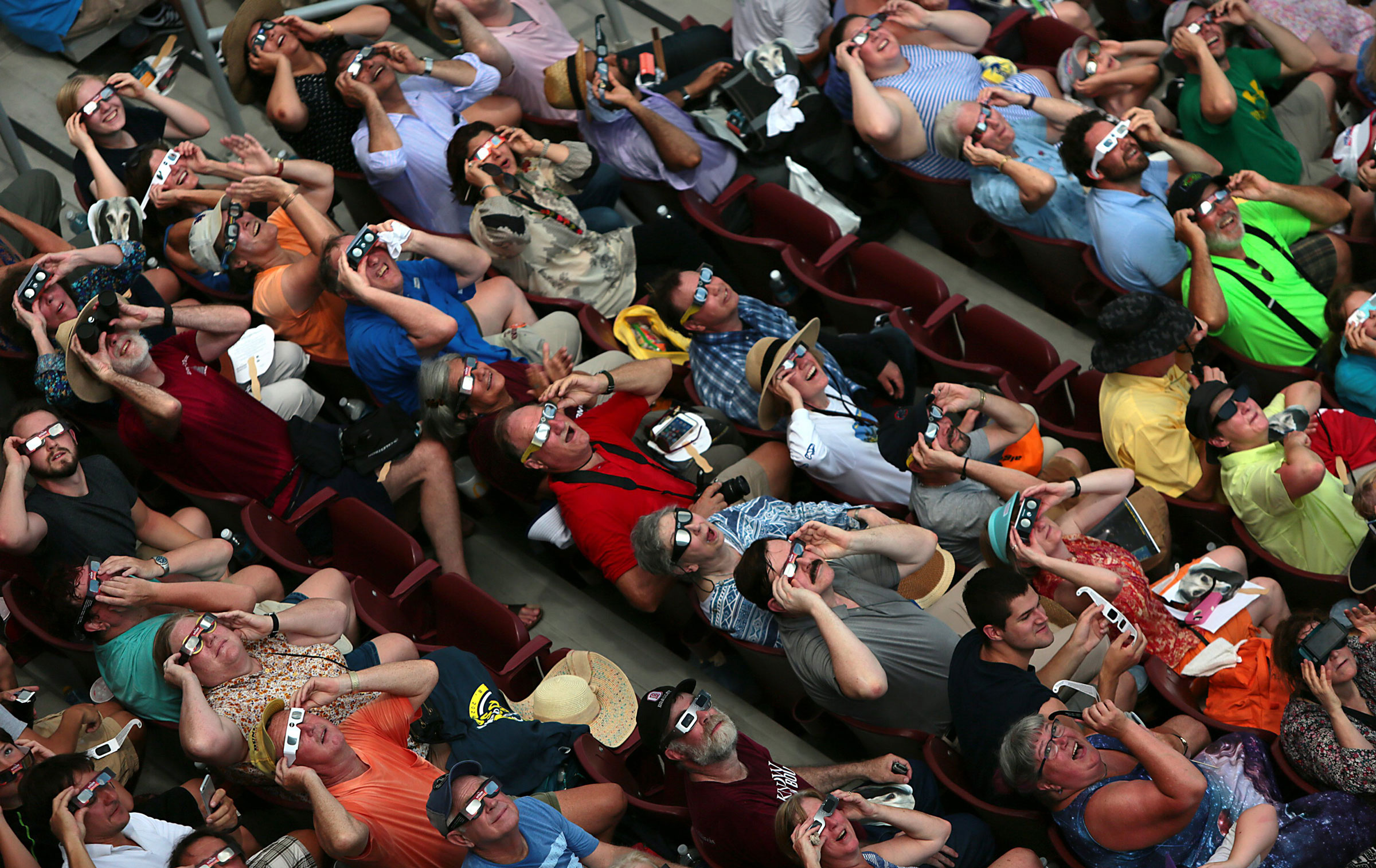 Clouds break in time to the cheers of fans who got to briefly see the total eclipse inside Saluki Stadium on the campus of Southern Illinois University Carbondale on Aug. 21, 2017.
