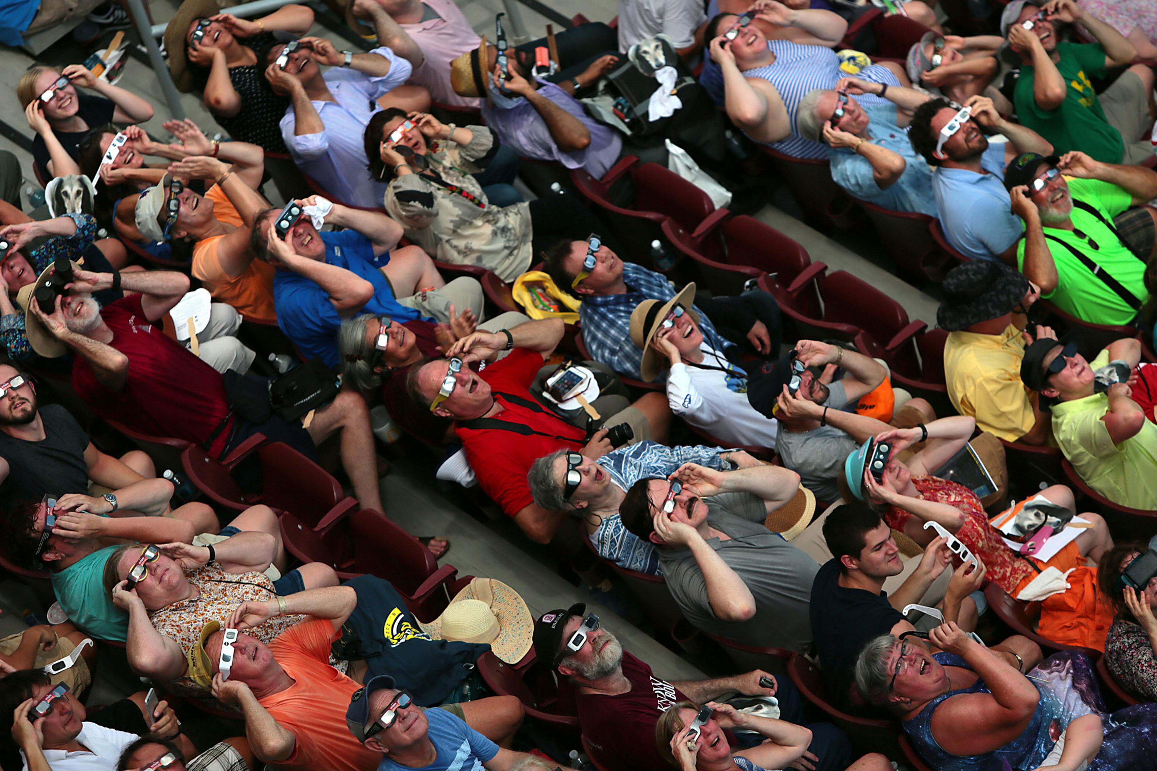 Clouds break in time to the cheers of fans who got to briefly see the total eclipse inside Saluki Stadium on the campus of Southern Illinois University Carbondale on Aug. 21, 2017.