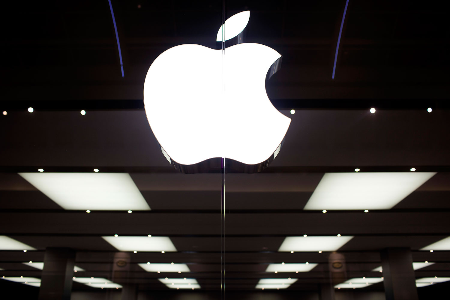 The Apple Inc logo sits on display at the company's store in the Gran Plaza 2 shopping mall in Majadahonda, near Madrid, Spain, on Friday, Sept. 28, 2012.