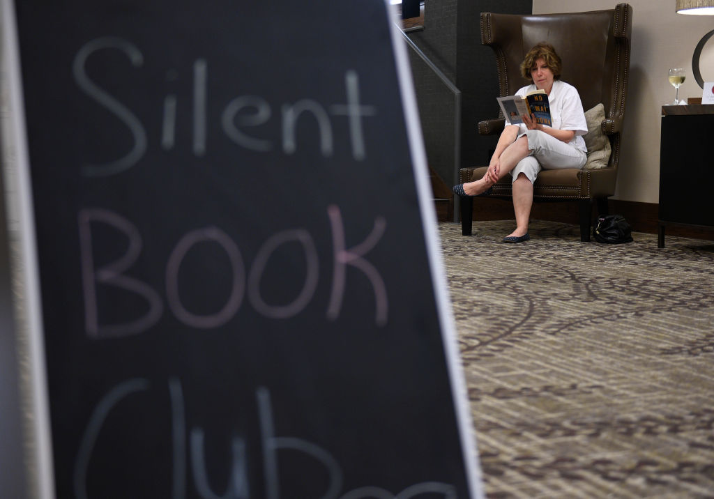Denise Sticha of Spring Township enjoys her book about the mountain K2.Reading Public Library hosts a Silent Book Club, encouraging readers to come enjoy a book in the lobby of the DoubleTree Hotel. Photo by Jeremy Drey 9/21/2017