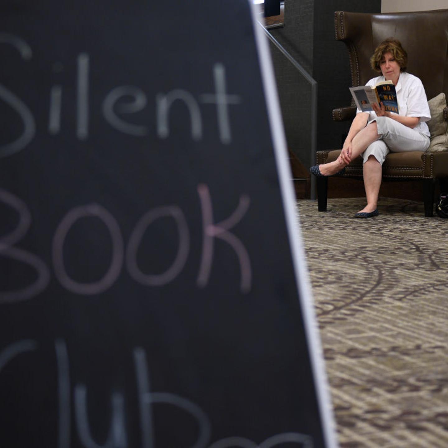 Denise Sticha of Spring Township enjoys her book about the mountain K2.Reading Public Library hosts a Silent Book Club, encouraging readers to come enjoy a book in the lobby of the DoubleTree Hotel. Photo by Jeremy Drey 9/21/2017