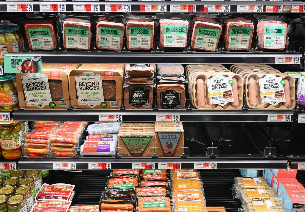 Packages of "Impossible Burger" and Beyond Meat sit on a shelf for sale on Nov. 15, 2019 in New York City.