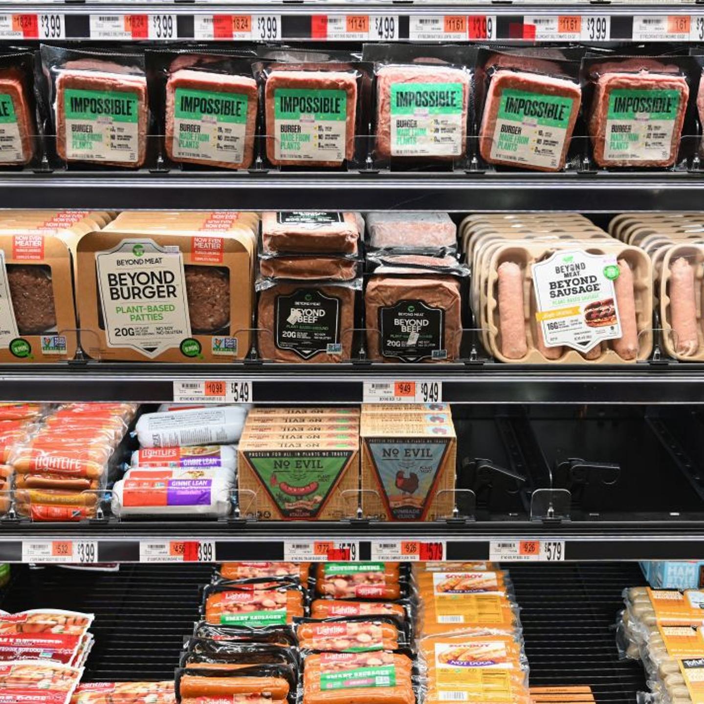 Packages of "Impossible Burger" and Beyond Meat sit on a shelf for sale on Nov. 15, 2019 in New York City.