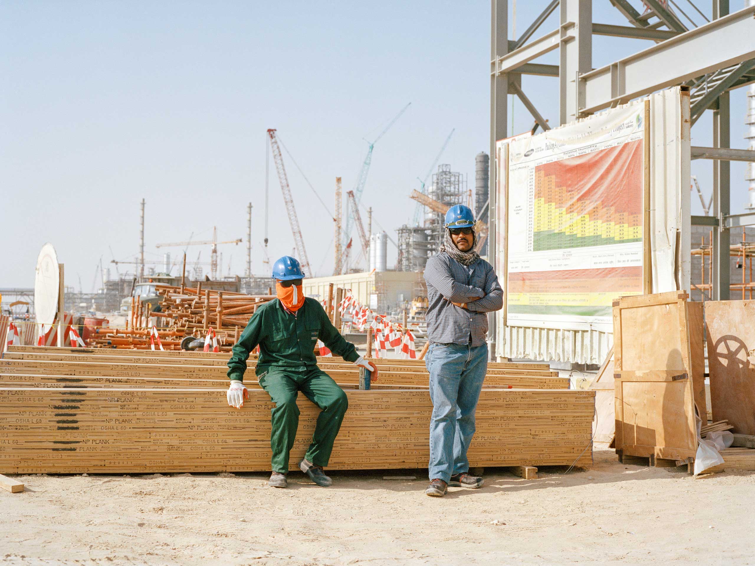 Construction workers setting up scaffolding