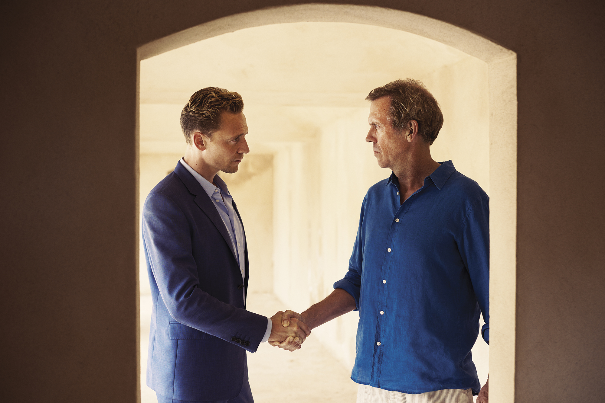 Tom Hiddleston as Jonathan Pine and Hugh Laurie as Richard Roper in The Night Manager, 2016.