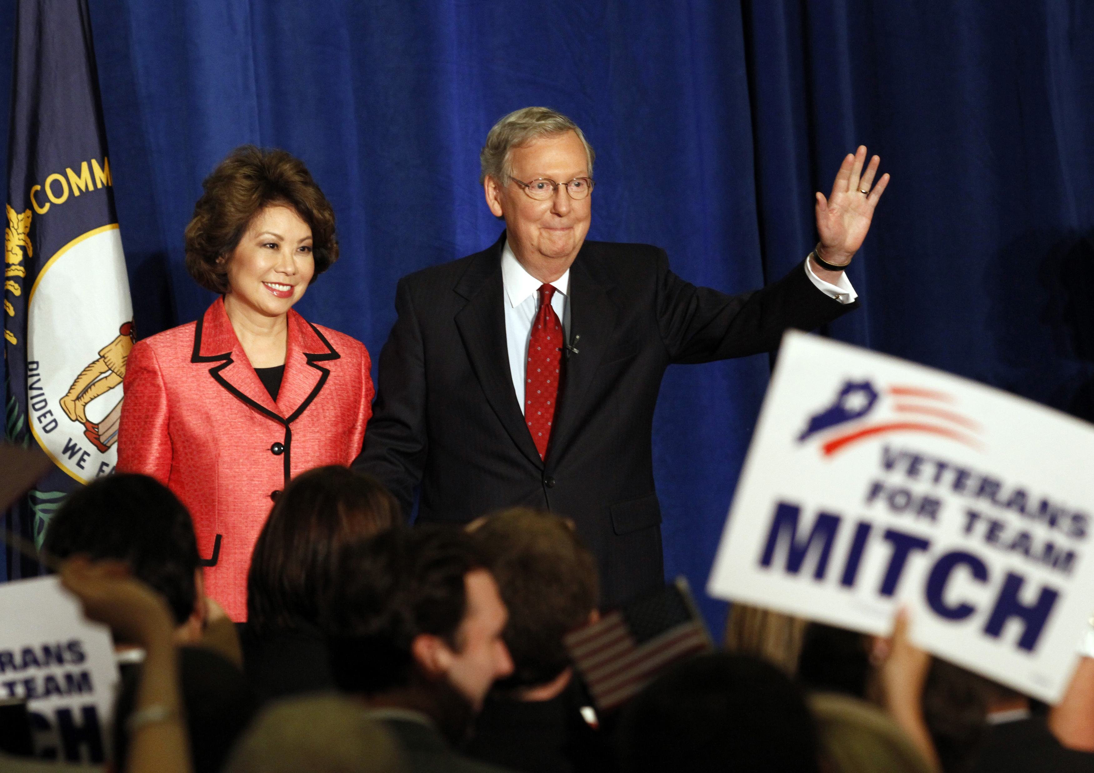 Senate Republican Leader Sen. Mitch McConnell and his wife Elaine Chao greet a crowd of campaign supporters after defeating Tea Party challenger Matt Bevin in the state Republican primary elections in Louisville, Ky., May 20, 2014.