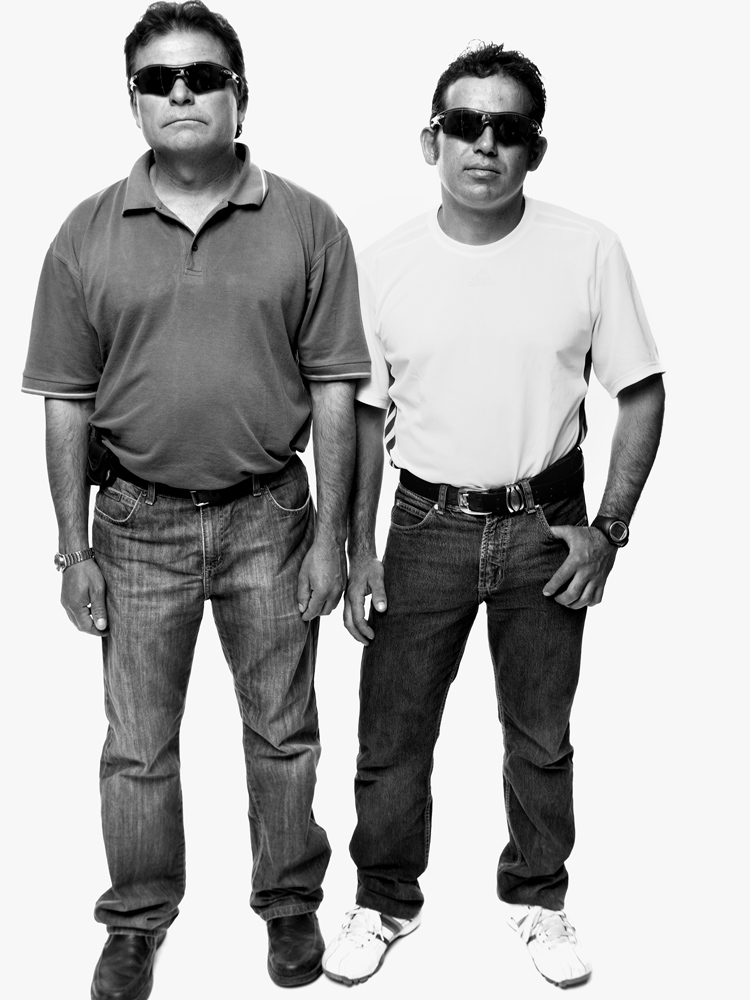 Pablo Rojas and Alex Vega wearing the sunglasses the miners wore to protect their eyes from the light when they emerged from the mine
