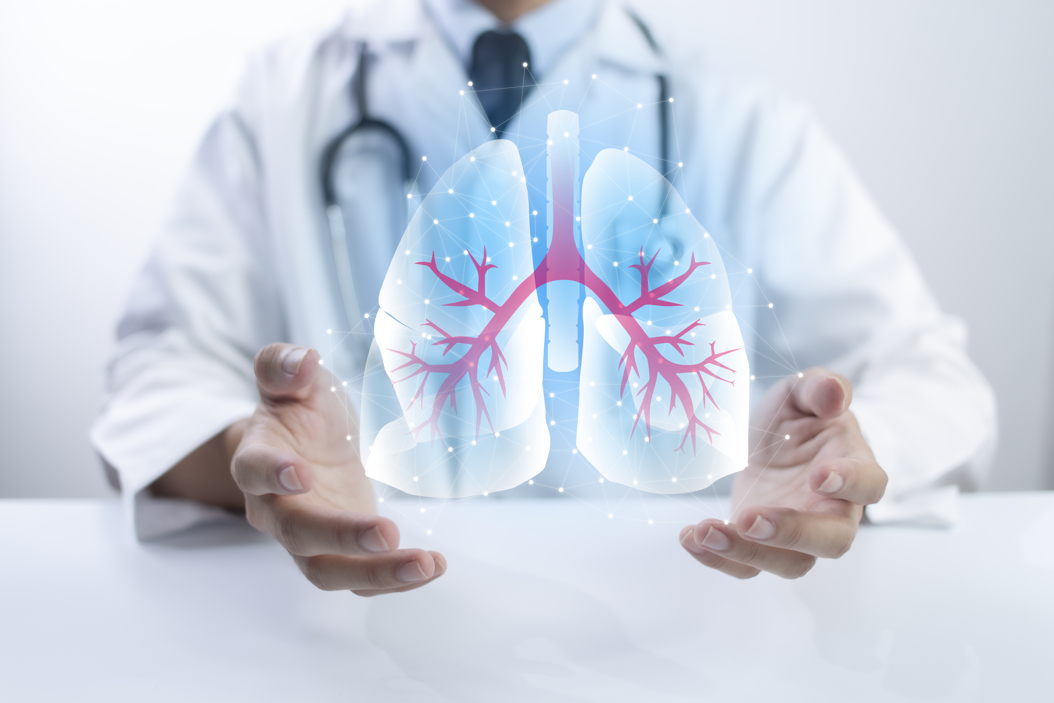 Pulmonologist doctor showing off virtual screen of lung medical issue. Healthcare medical technology concept.