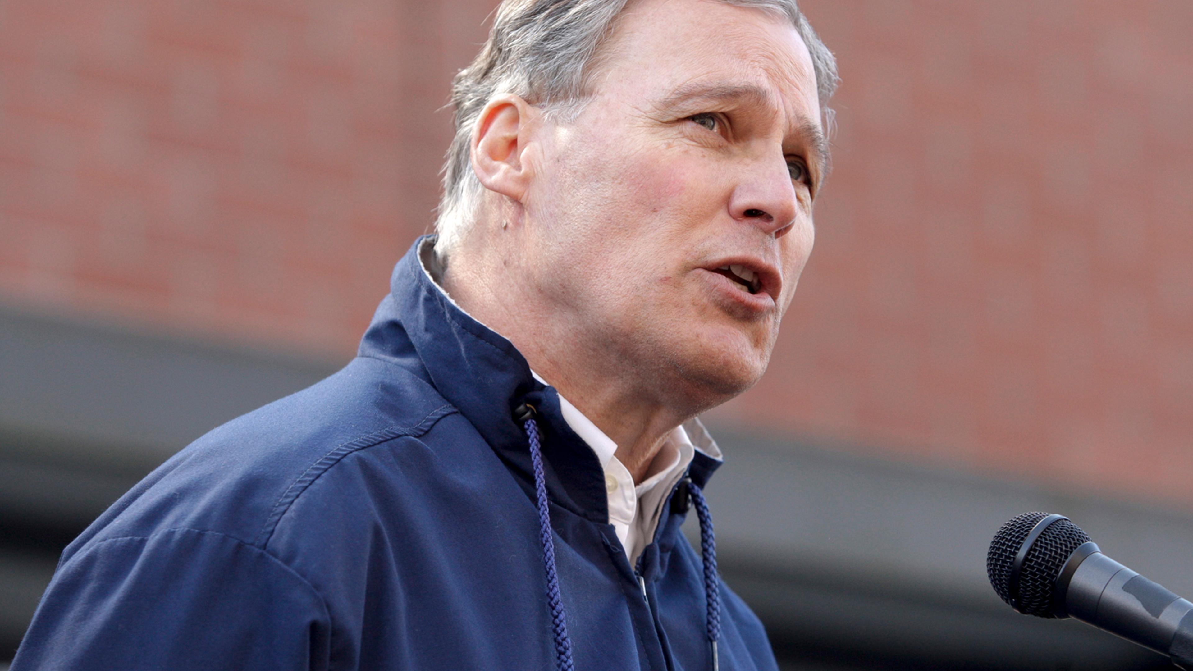 Governor Jay Inslee addresses the media outside the Arlington Police Department in Arlington, Washington