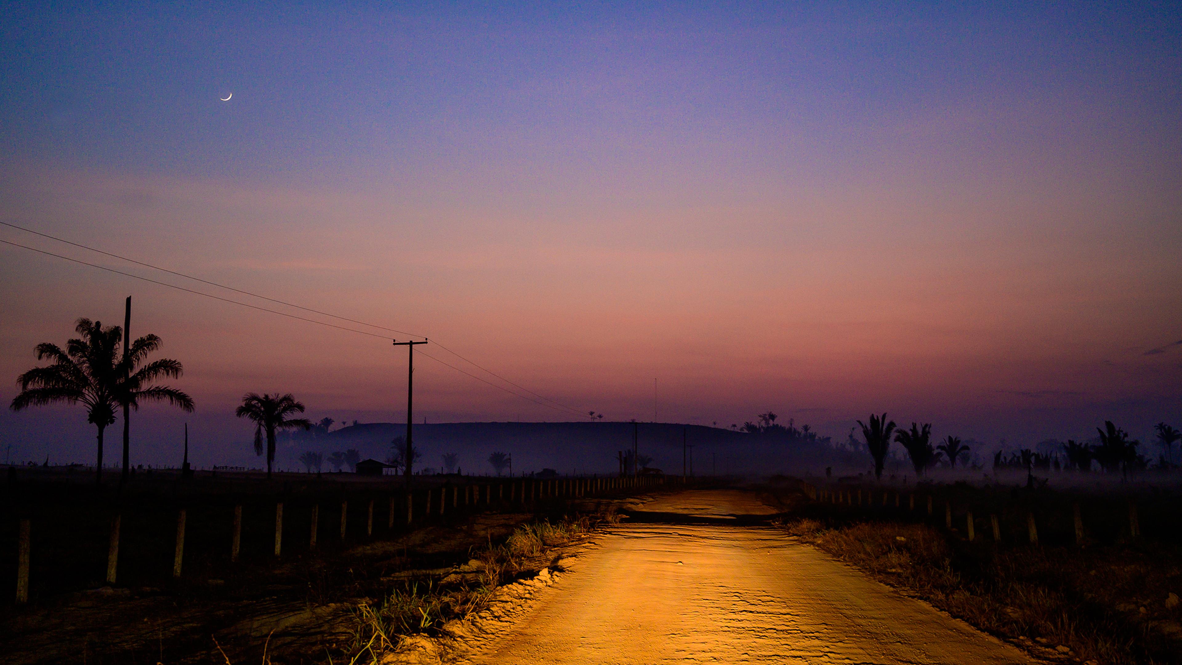 A dirt road is illuminated in the region of Vila Nova Samuel, near the Jacundá National Forest, on Aug. 28.