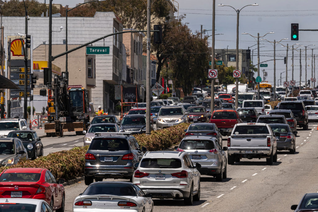Traffic moves past a San Francisco gas station in early June.