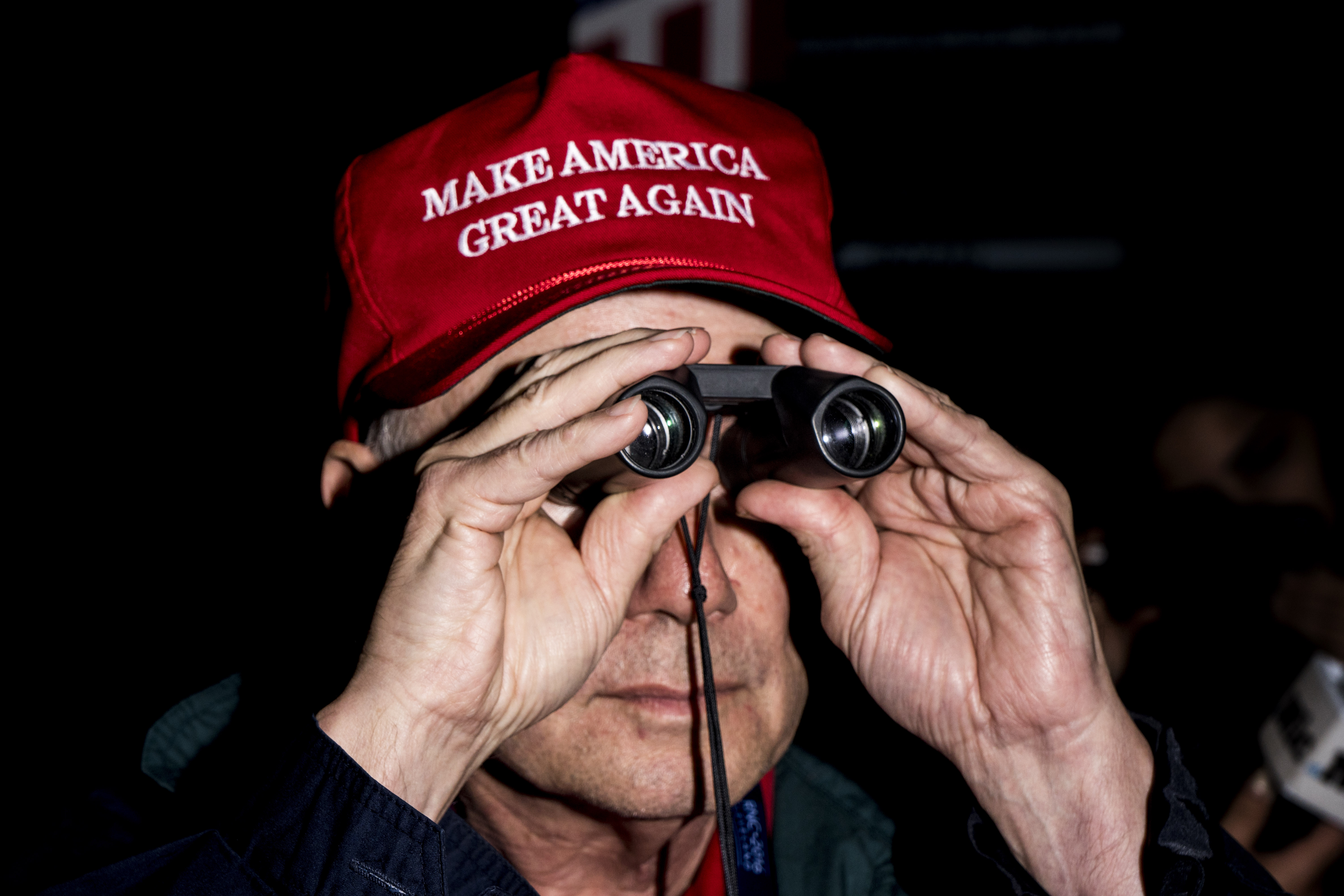 A man dons a "Make America Great Again" hat at the Republican National Convention in Cleveland.