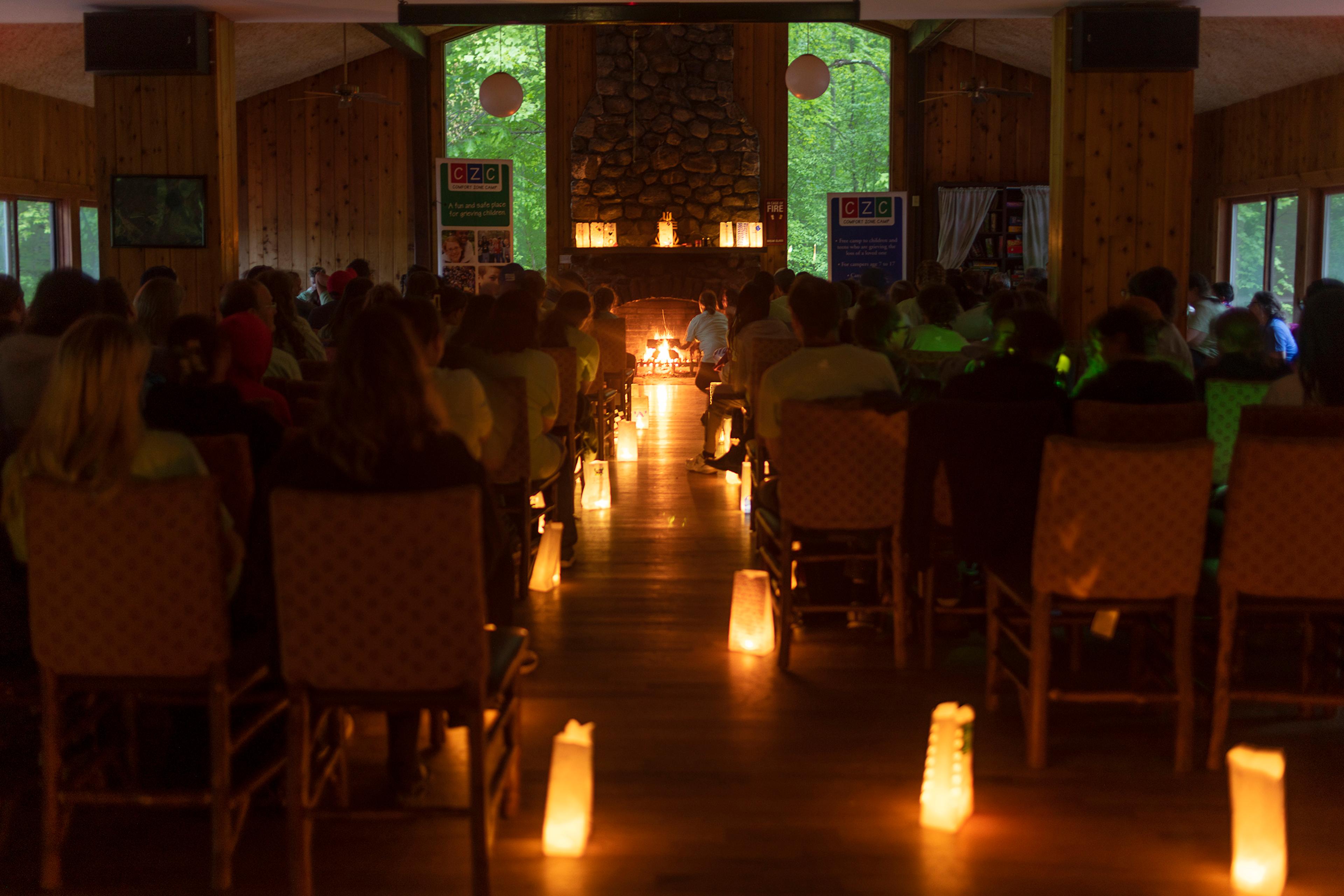 Campers, buddies, and staff gather for a memorial ceremony.