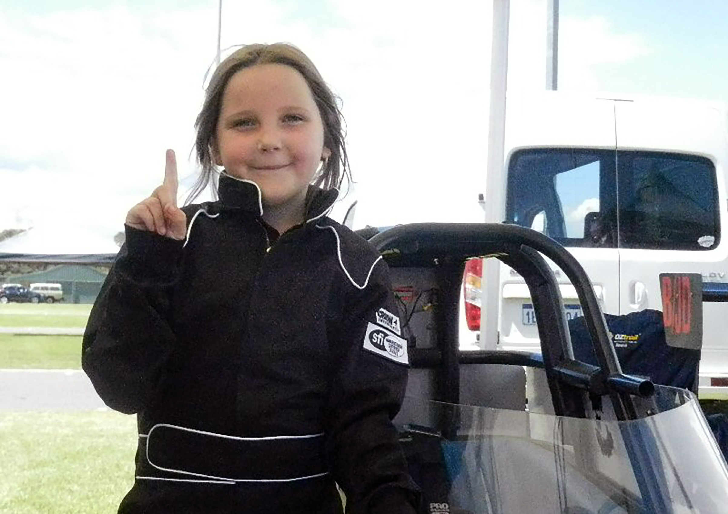 A handout photo from Junior Dragster Australia on Oct. 14, 2017, shows Anita Board, 8, next to her junior dragster racing car.
