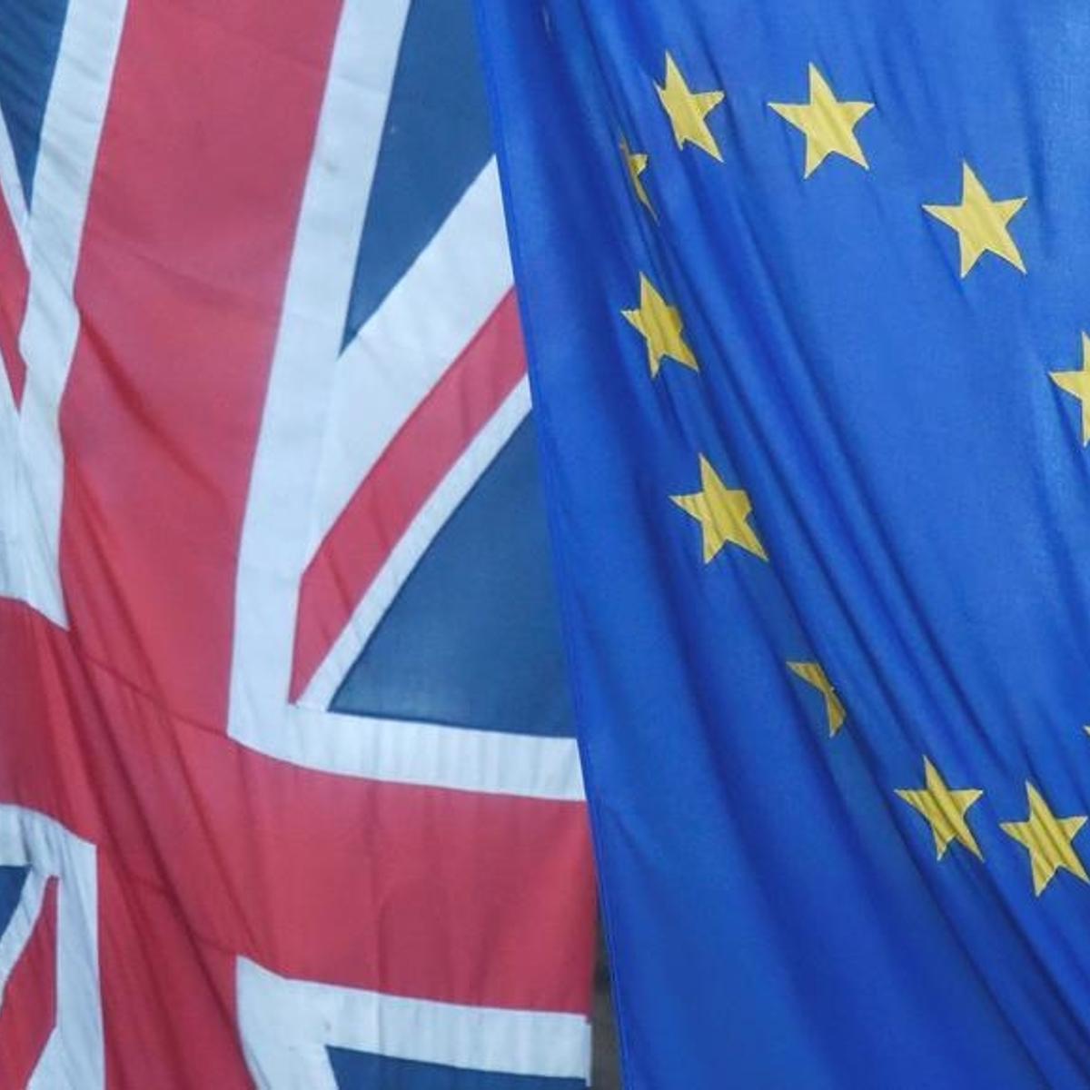 A Union flag flies next to the flag of the European Union in Westminster, London