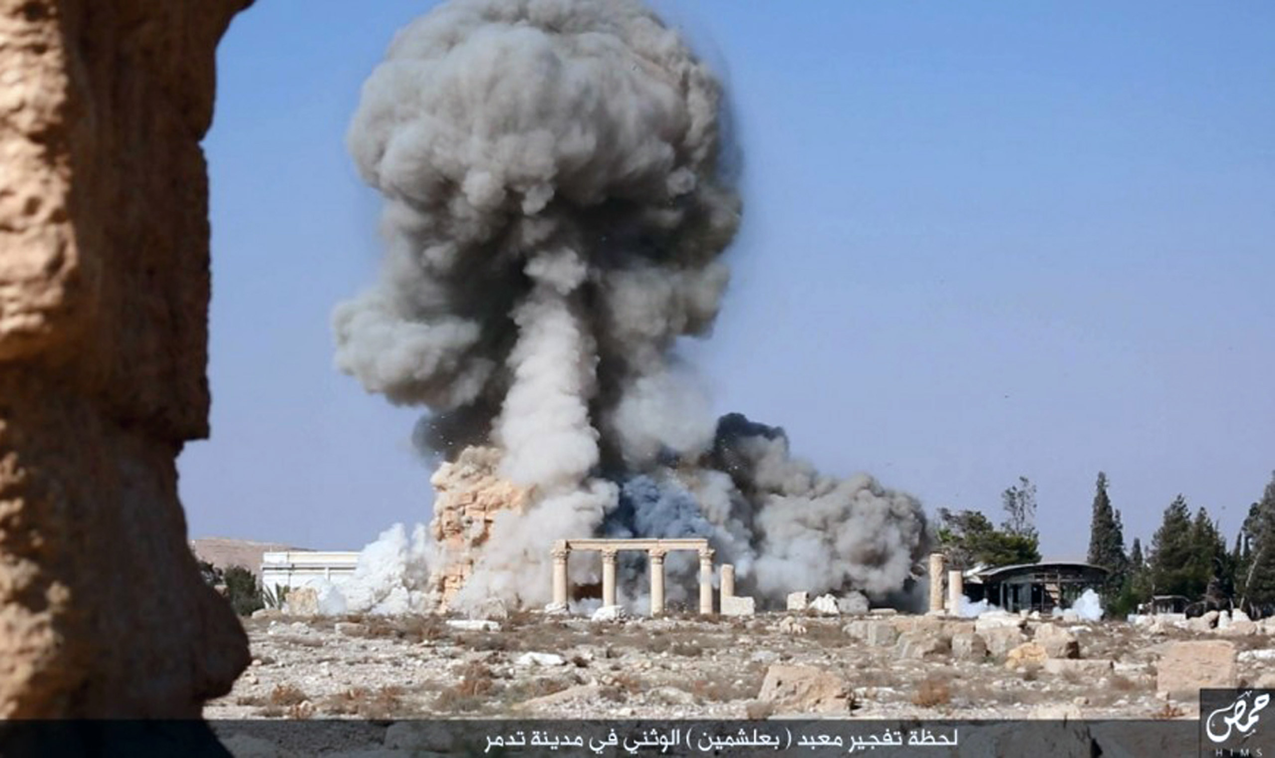 This undated photo released Tuesday, Aug. 25, 2015 on a social media site used by Islamic State militants, which has been verified and is consistent with other AP reporting, shows smoke from the detonation of the 2,000-year-old temple of Baalshamin in Sy