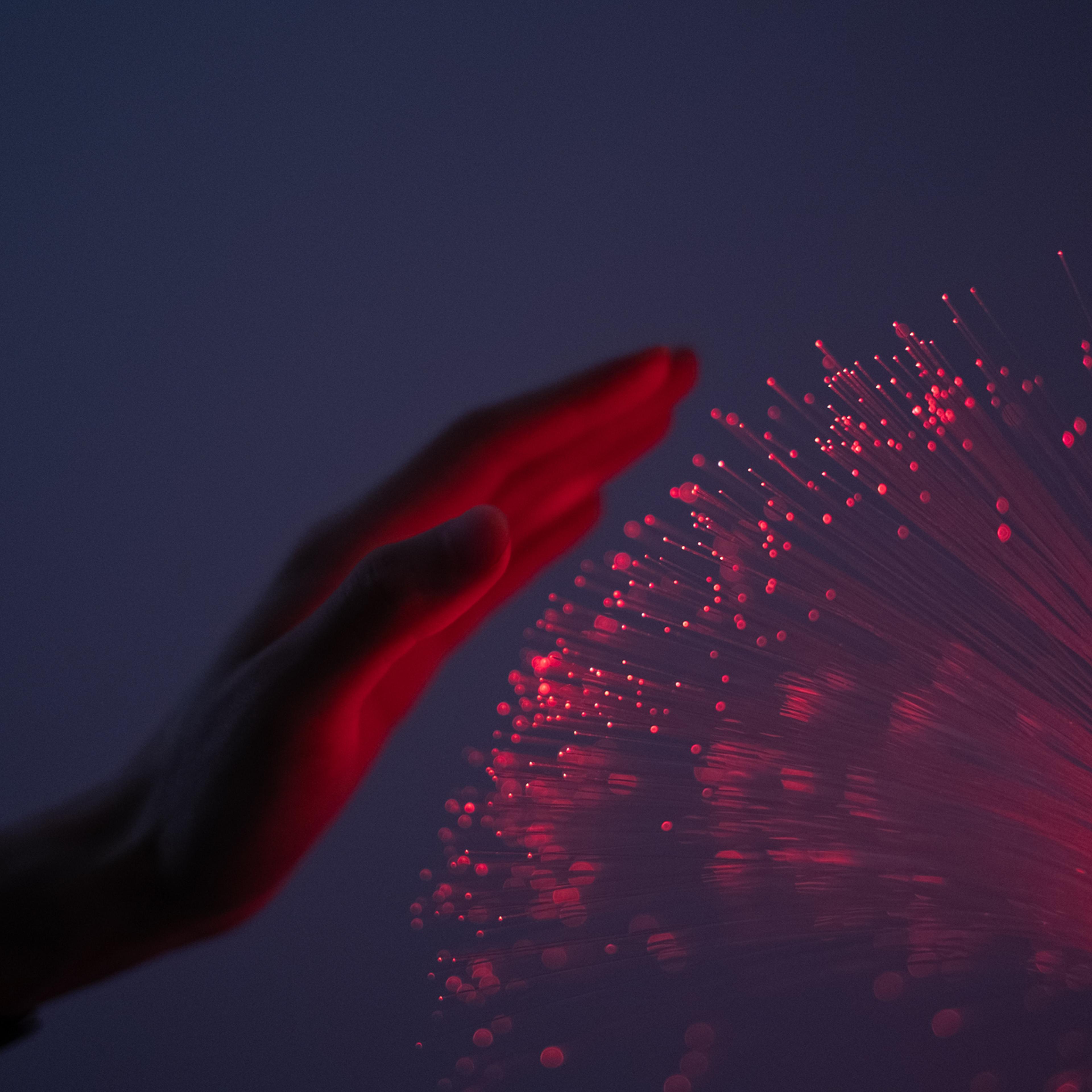 Close-up of finger touching fiber