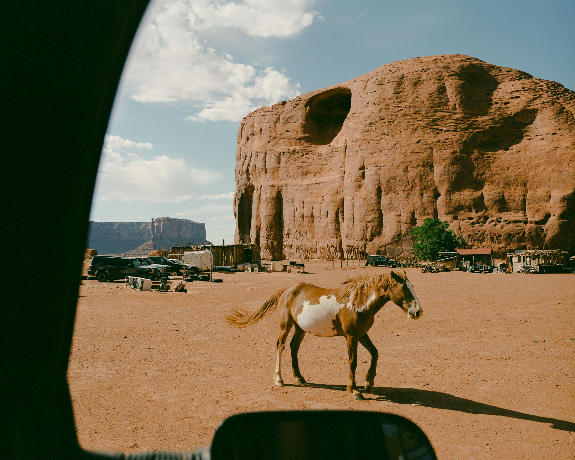 Water For a Day 
For a third of Diné households, simply obtaining water for everyday use at home saps enormous quantities of time and money. The Navajo Nation’s infamously rough roads make water runs lengthy and wreak havoc on vehicles. Lines to fill at often far flung town spigots, springs, and wells can stretch four hours long. Here fuel prices exceed the national average which presents an especially acute burden for the Diné who earn about two-fifths of the average American and already pay some of the highest prices for basic goods.