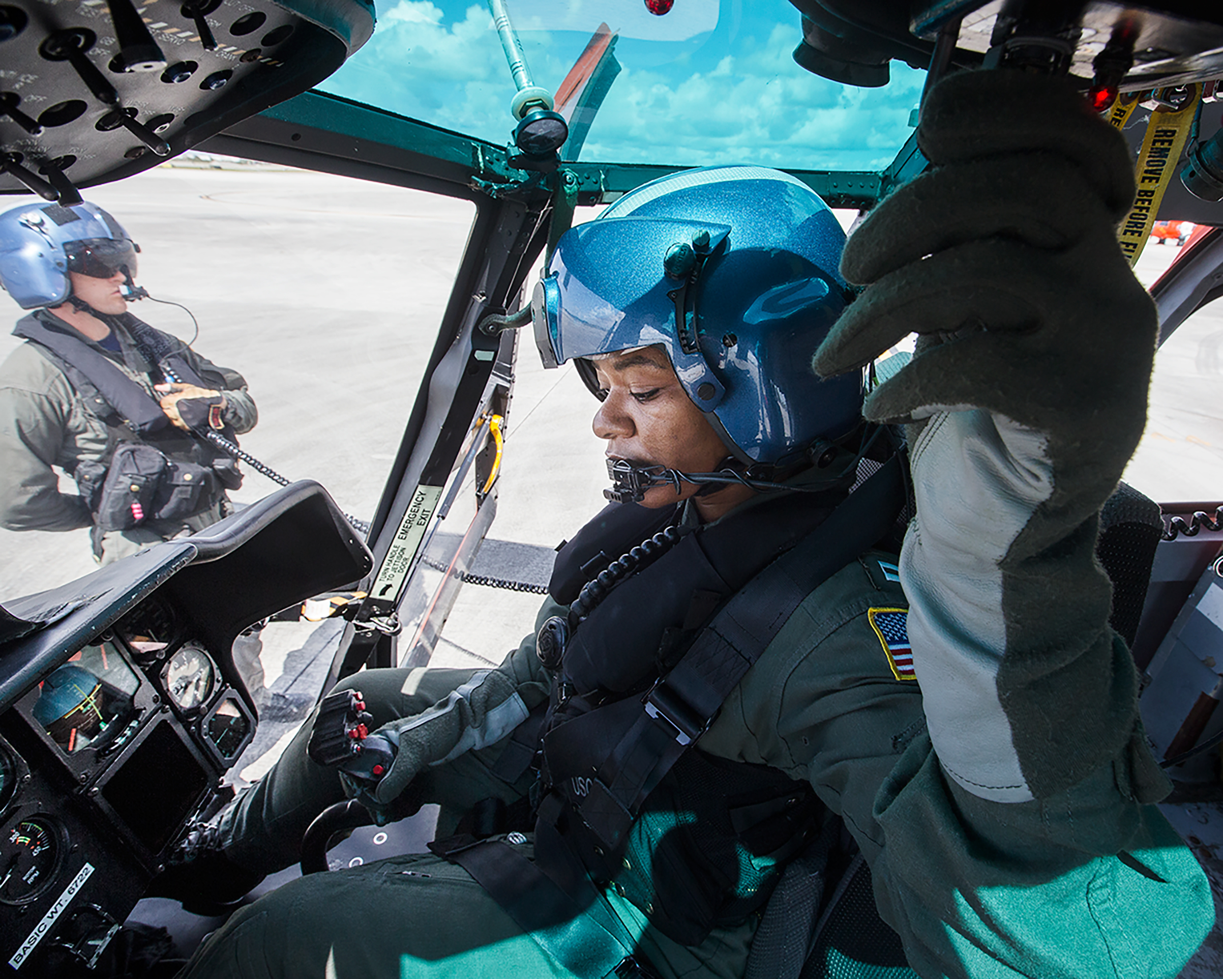A U.S. Coast Guard lieutenant prepares for damage assessment and search and recovery efforts for Hurricane Irma