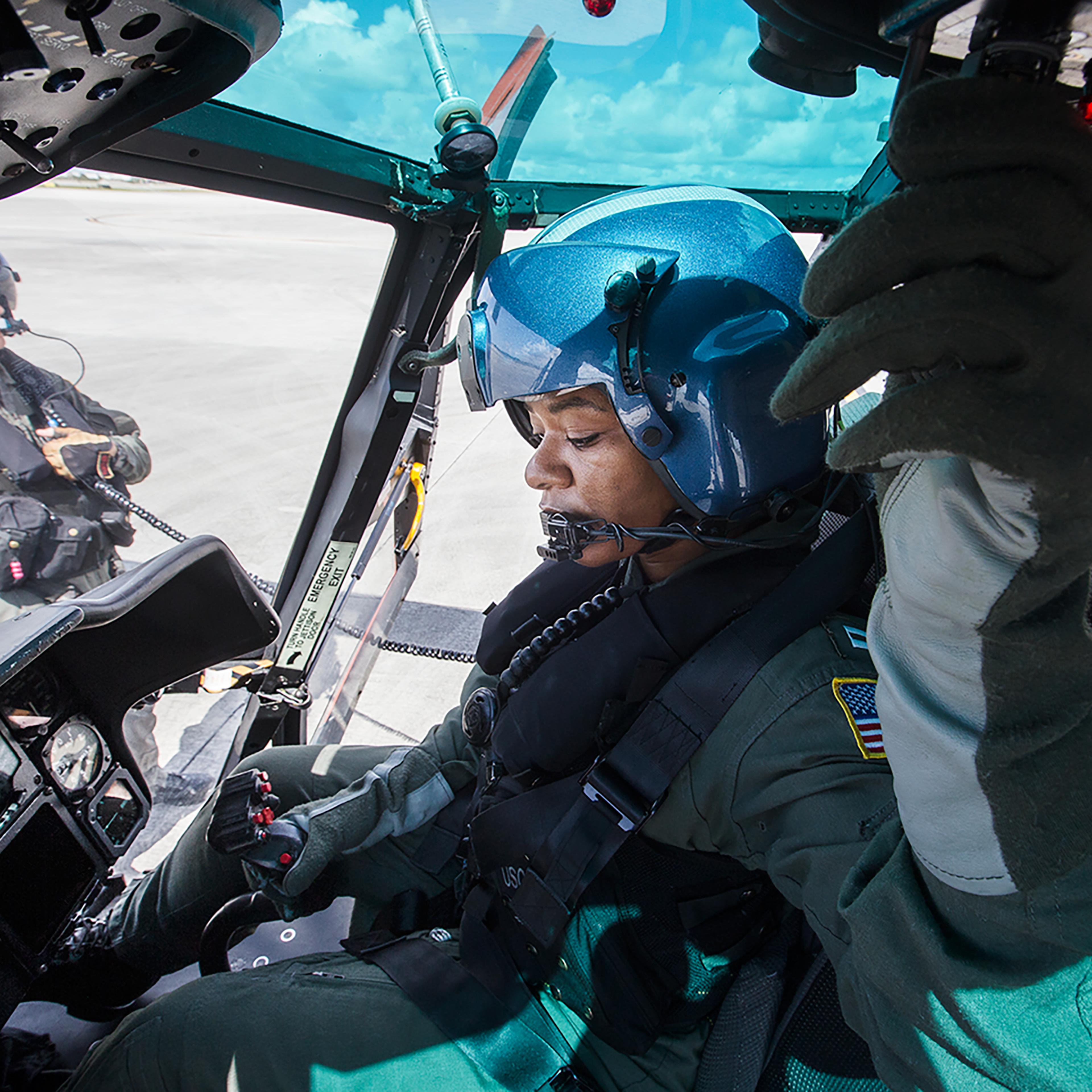 A U.S. Coast Guard lieutenant prepares for damage assessment and search and recovery efforts for Hurricane Irma