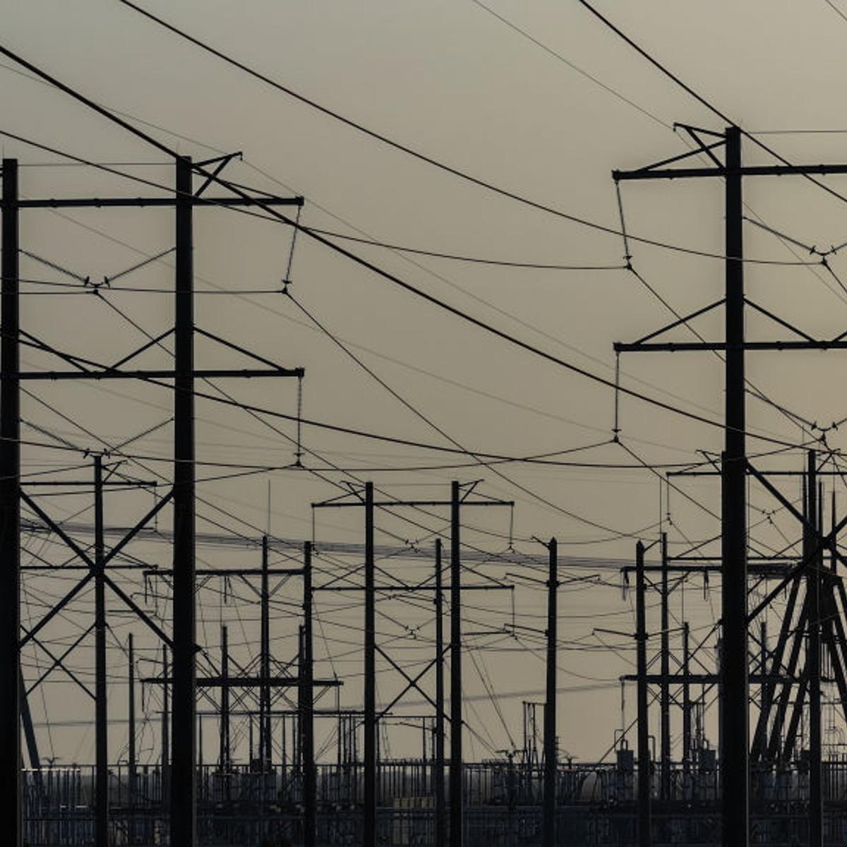 PEMBROKE PINES, FLORIDA - MAY 16: High voltage power lines run along the electrical power grid on May 16, 2024, in Pembroke Pines, Florida. The grid is strained by increasing demand from electricity-hungry data centers and electric vehicles, disruptions due to severe weather events, and more.