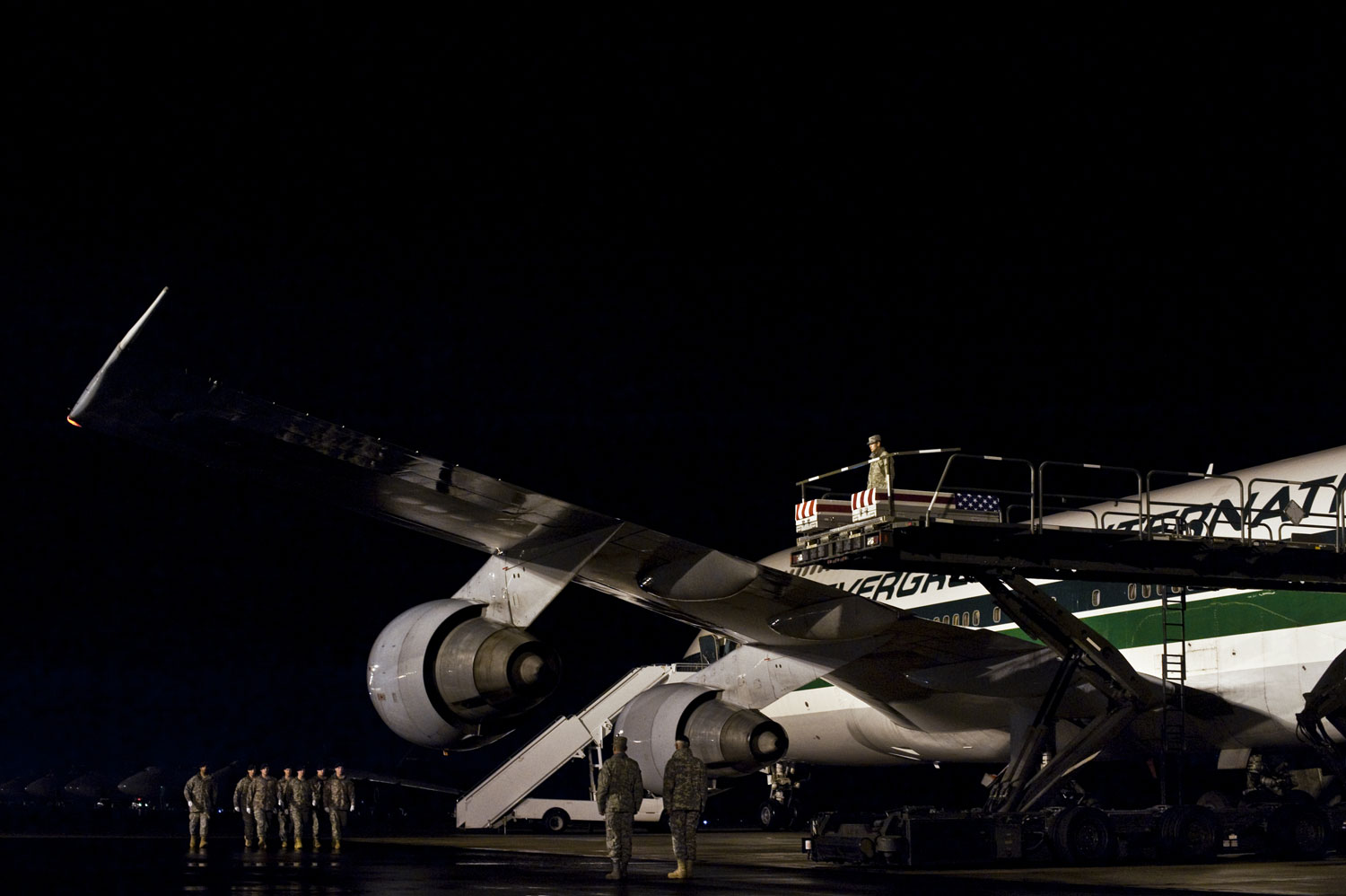 <b>Silent Night</b> <br>
The remains of Staff Sergeant William Ricketts, killed in Afghanistan, arrive at Dover Air Force Base on March 2. Sgt Ricketts, 27, was felled by small arms fire on February 27. On his fifth tour of duty in Iraq and Afghanistan, he had signed up for service on the day after the 9/11 attacks.
