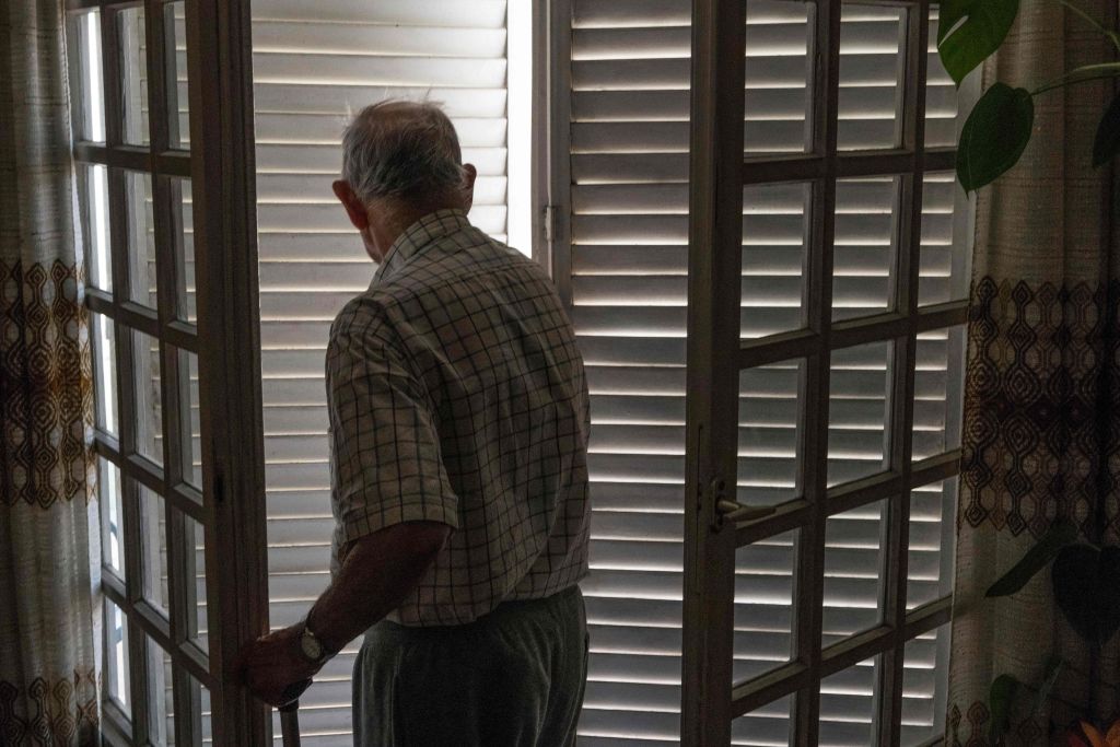 An elderly person closes his shutters to keep cool and to avoid heatstroke during the heatwave on June 25, 2019 in France.