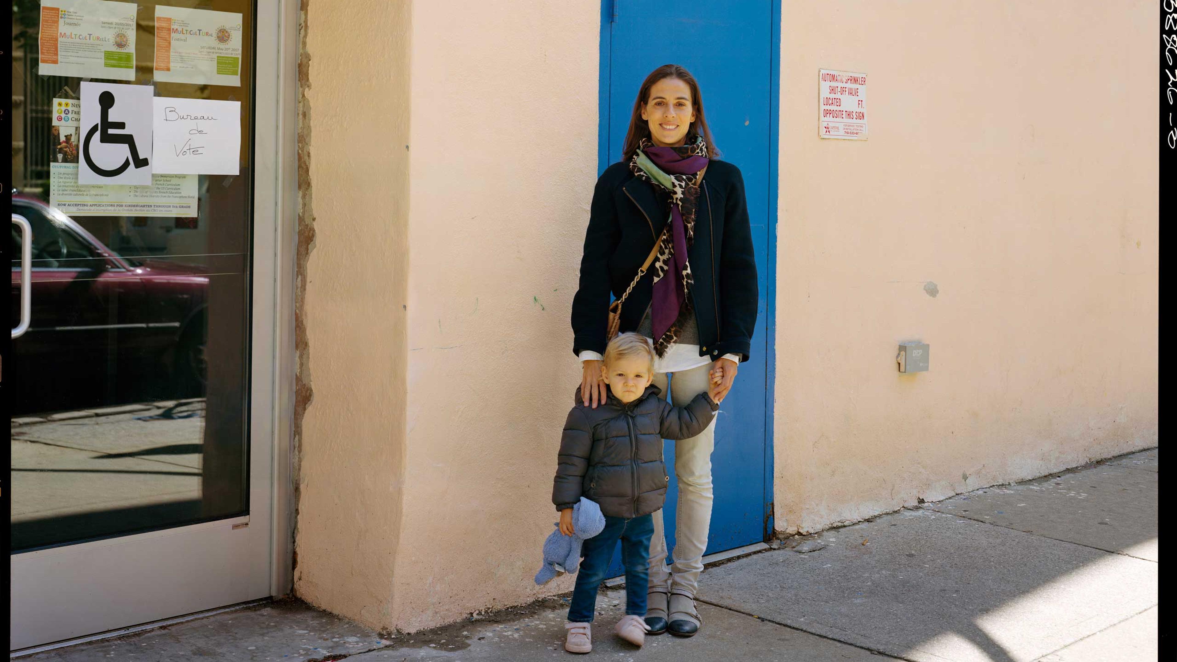 <b>Translation of caption from <i>Liberation:</i><b> May 6, 10:15 am, Harlem. Maïa Dibie, accompanied by her daughter Inna, voted this morning at the polling station of the French American Charter School, which offers bilingual education (half in French, half in English) in northern Manhattan. Maïa is director of an artist’s studio, she has lived here since 2003. Among the French voters of New York, Emmanuel Macron received 94.7% of the votes in the second round of the presidential elections.