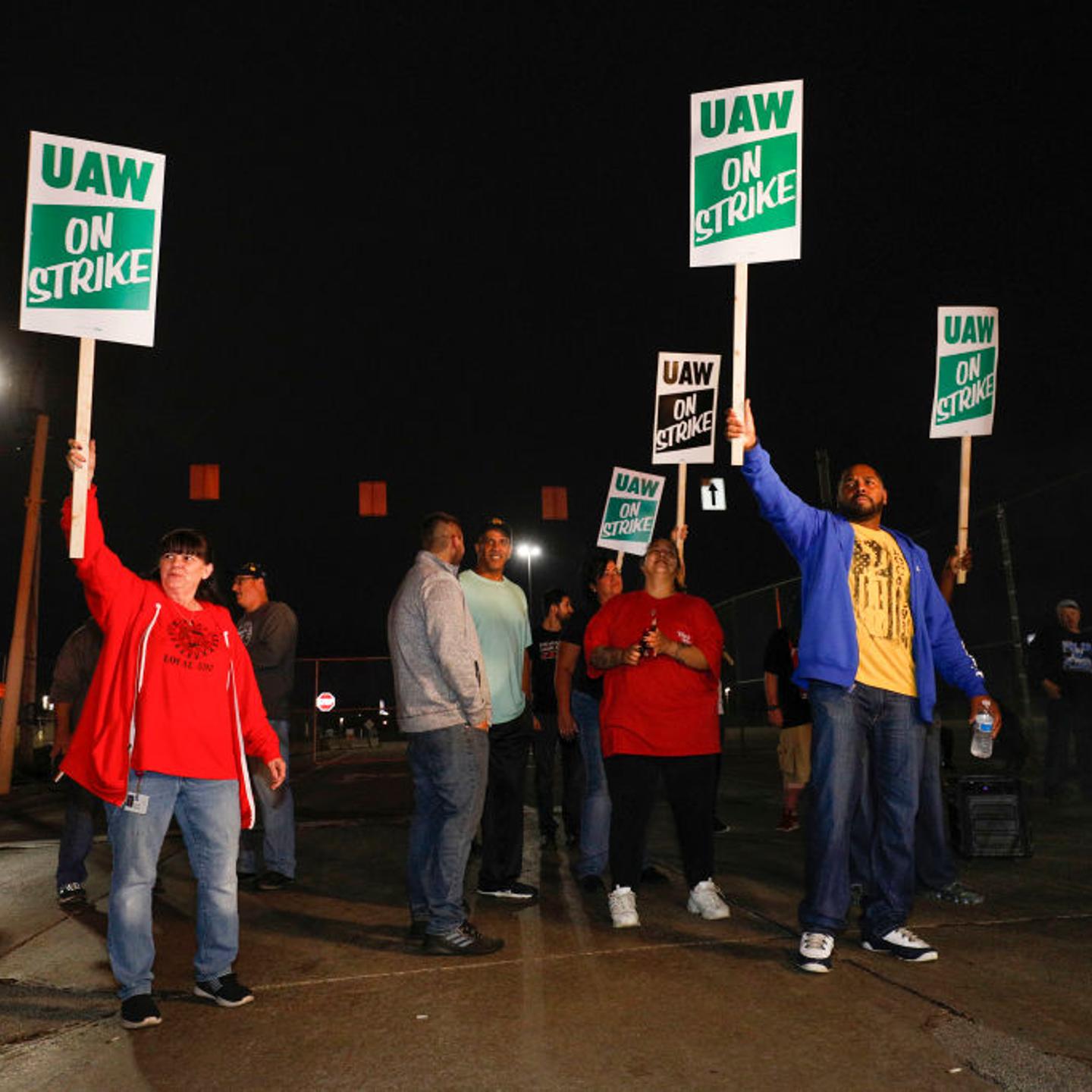 United Auto Workers (UAW) members picket line at a gate at the General Motors Flint Assembly Plant