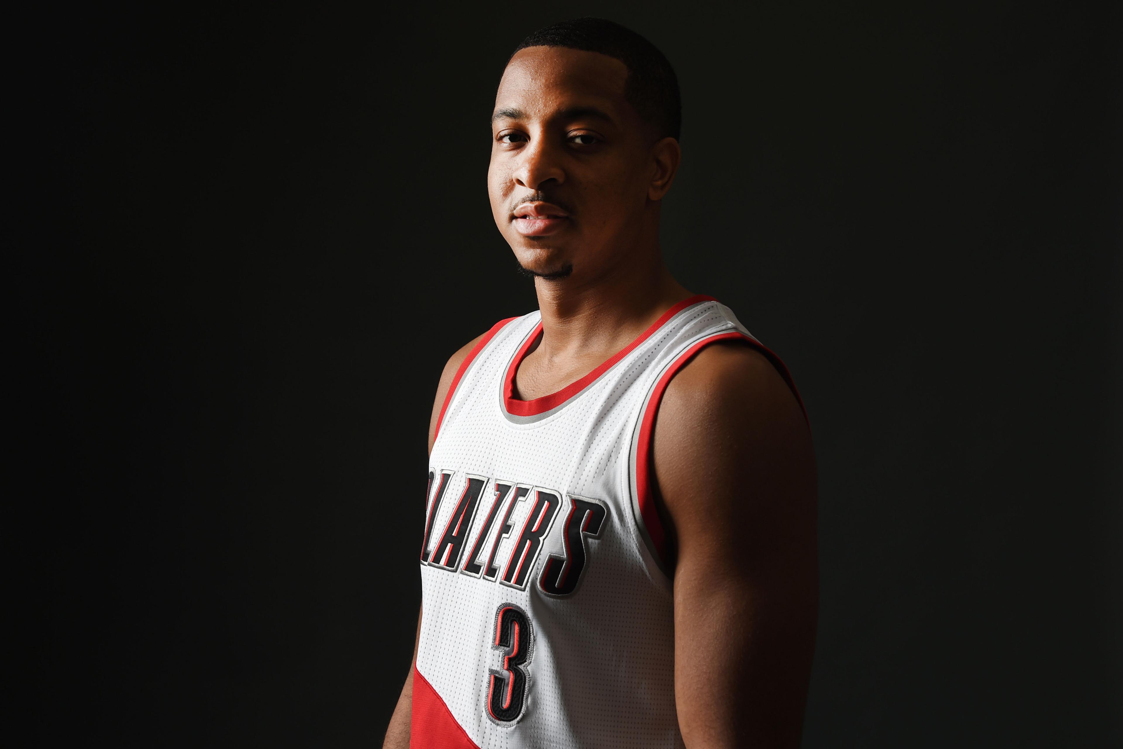 Portland Trail Blazers guard C.J. McCollum (3) poses for a photograph during Portland Trailblazers media day in Portland, Ore., Monday, Sept. 26, 2016. (AP Photo/Steve Dykes)