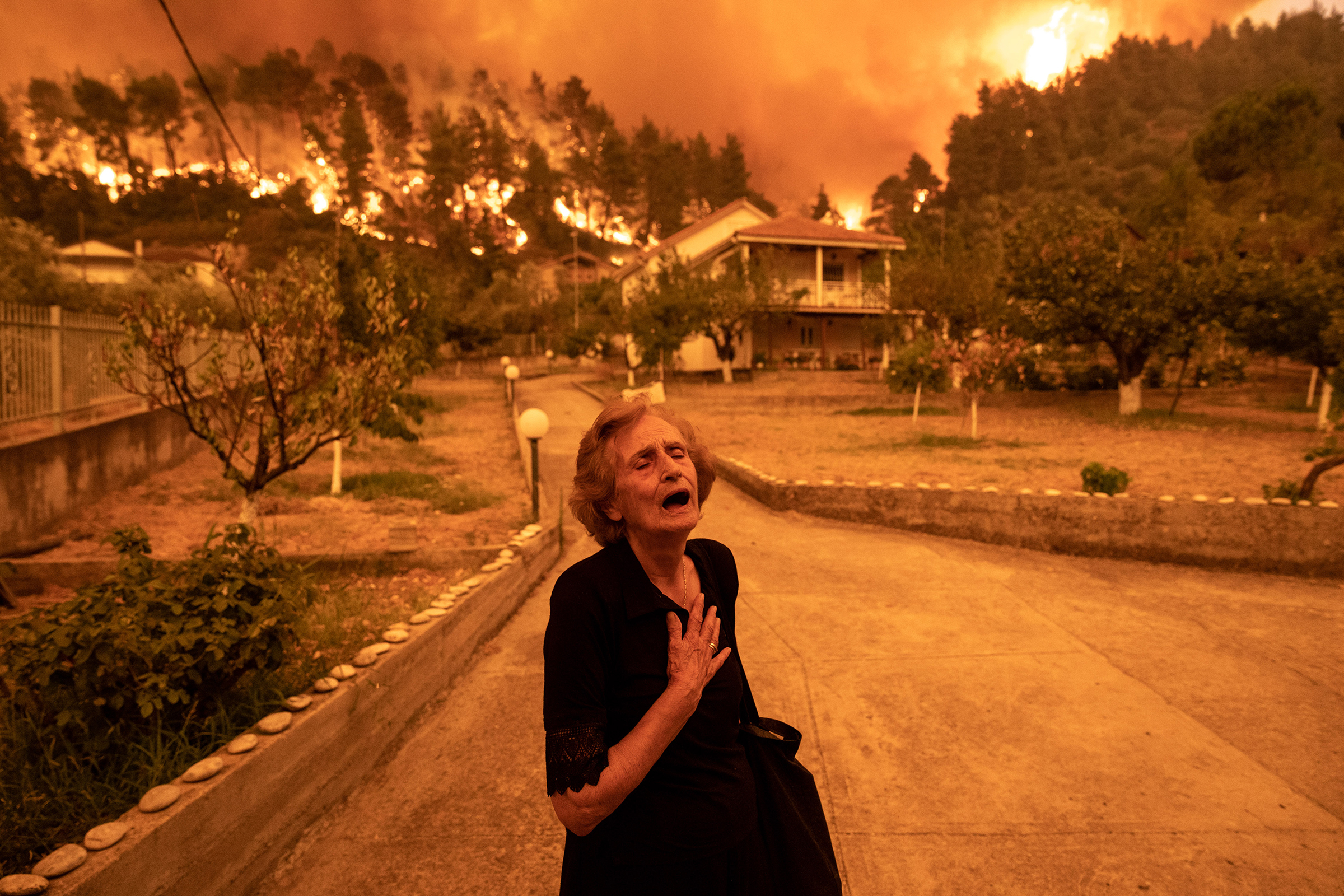 Residents Evacuate Greek Island Hit By Wildfires