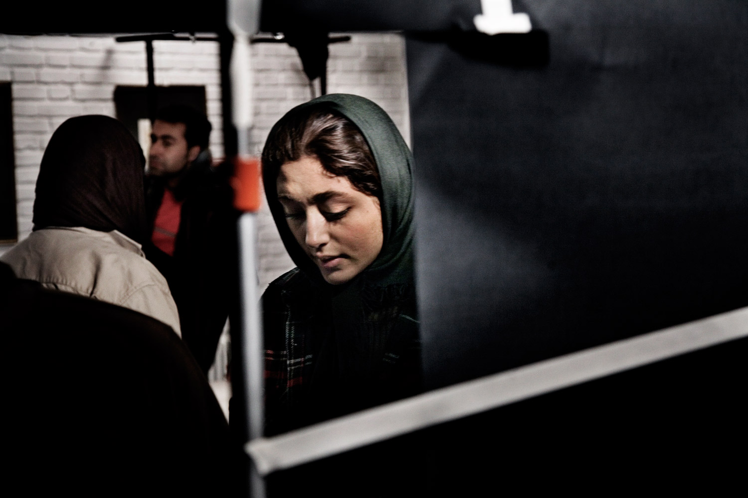 Production pauses on set during the filming of <em>A Woman Is Always Involved</em> by Kamal Tabrizi in Tehran.