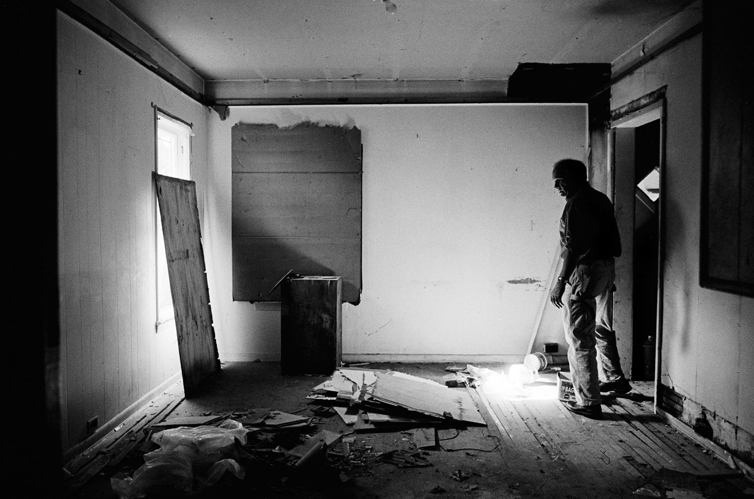 Fred Ford of Neighborhood Progress inspects an empty home in Cleveland in July 2010.