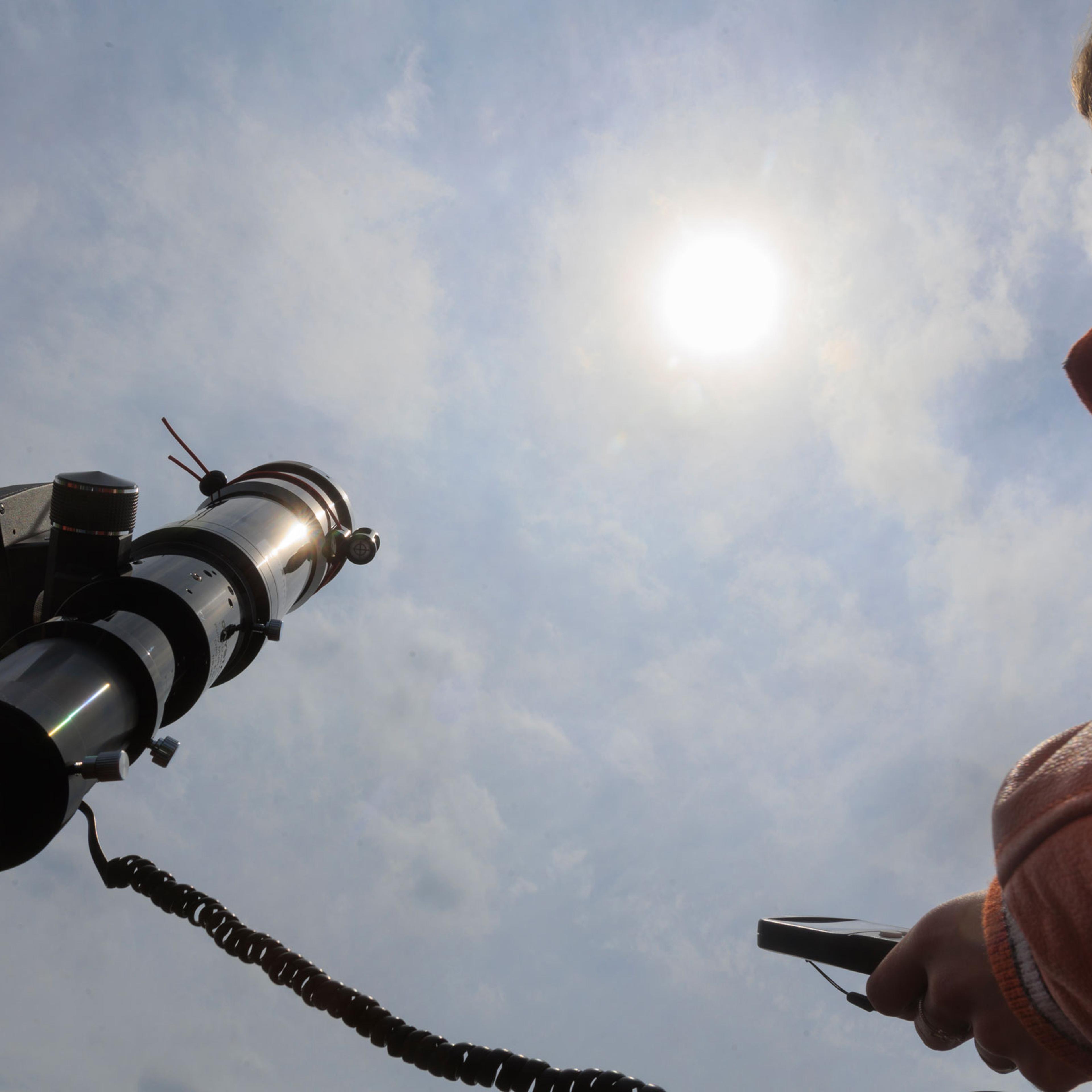 A student calibrates a telescope to follow the position of the sun during a practice session at Kemp High School in Kemp, Texas, on March 24, 2024.