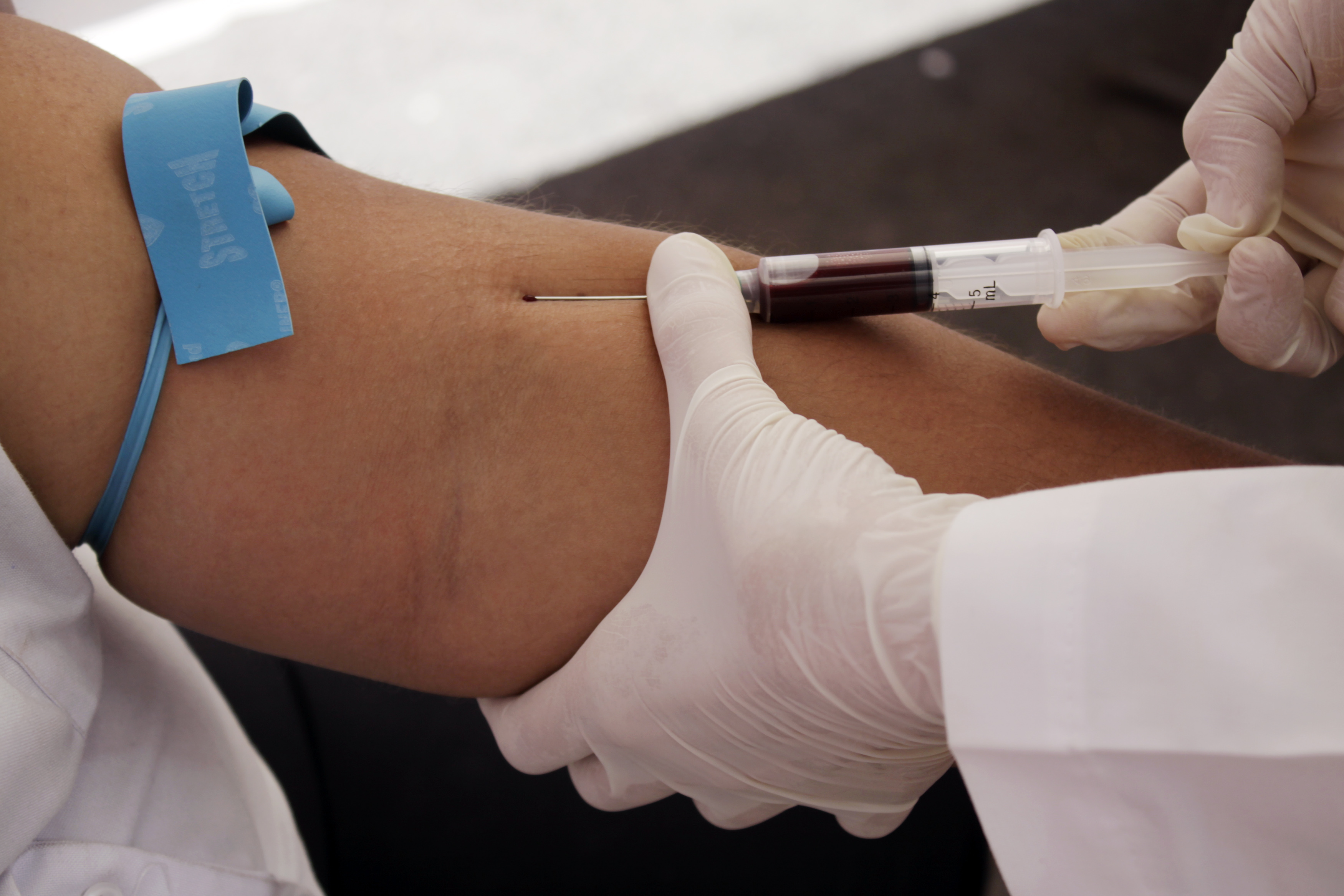 A nurse takes blood for a free HIV test, during an HIV/AIDS awareness rally on World AIDS Day in San Salvador