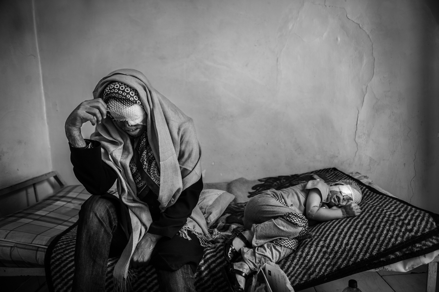 <em>The following photographs were taken between May and December of 2012.</em><br><br>Sommayeh and her daughter Rana rest in a hostel in downtown Tehran. The two have shuttled to the Iranian capital for treatment after Sommayeh's husband attacked the family with acid.