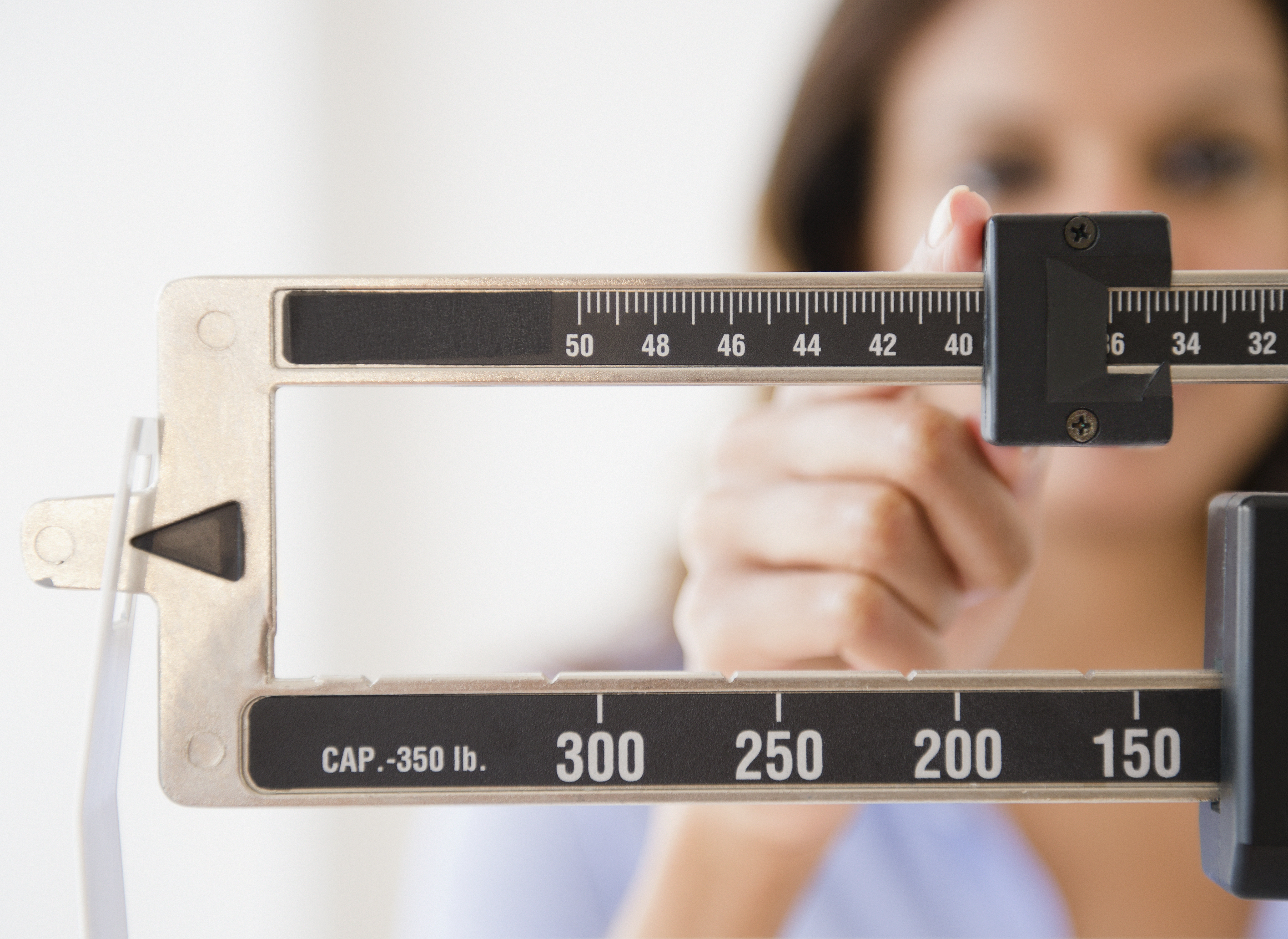 woman-weighing-herself